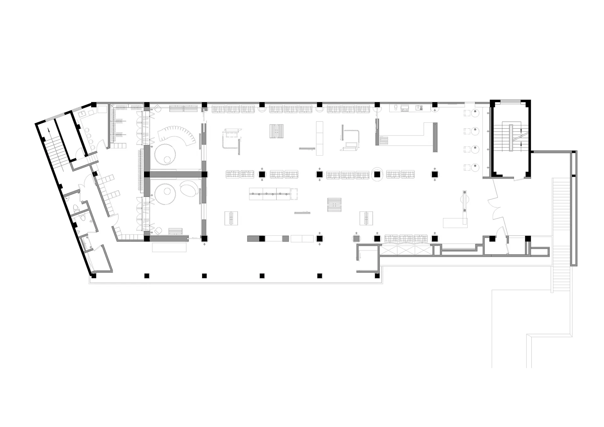 Floor plan of an industrial-style office space, featuring open workstations and meeting areas.
