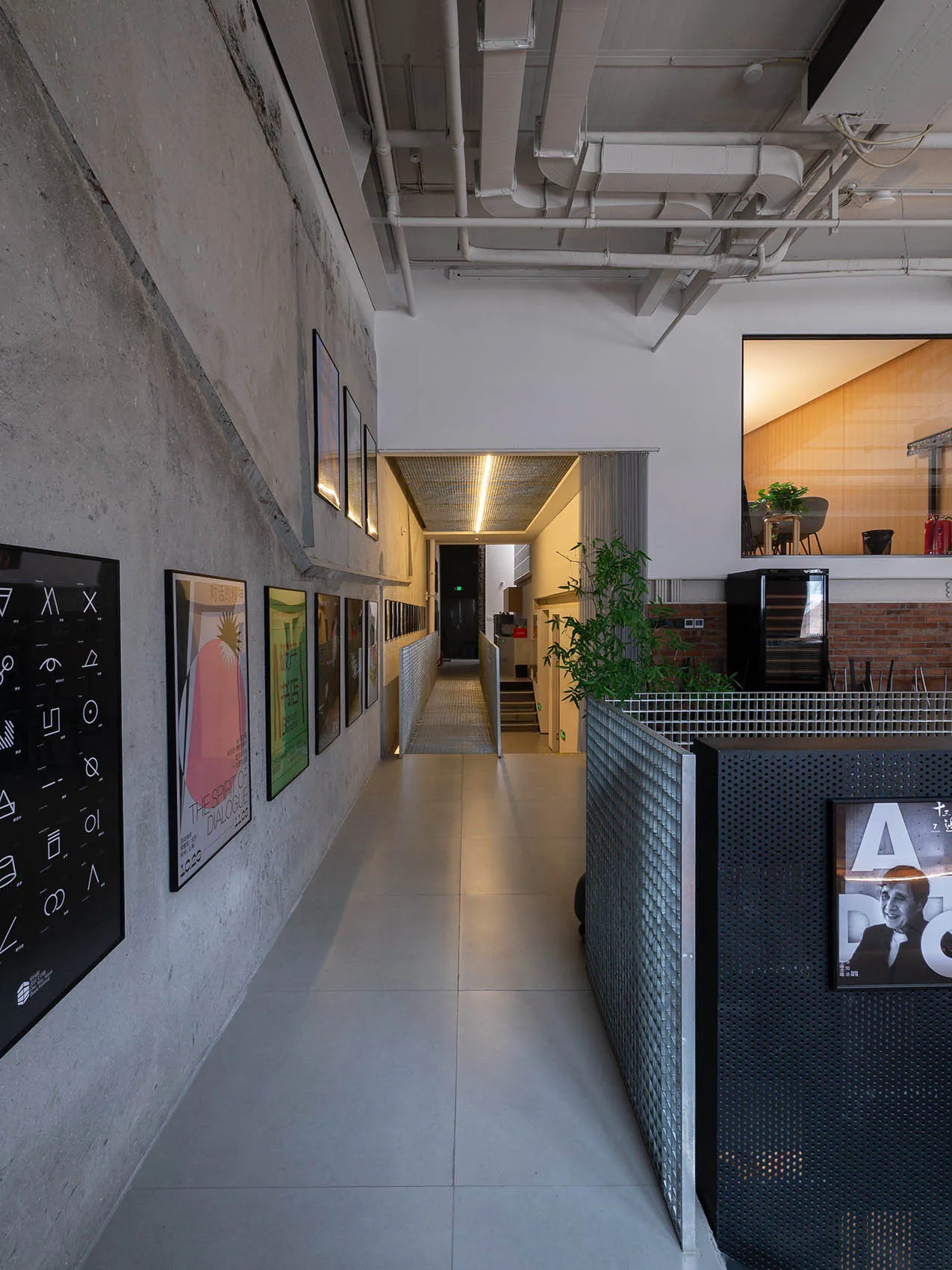 Modern office space with concrete walls and industrial lighting fixtures