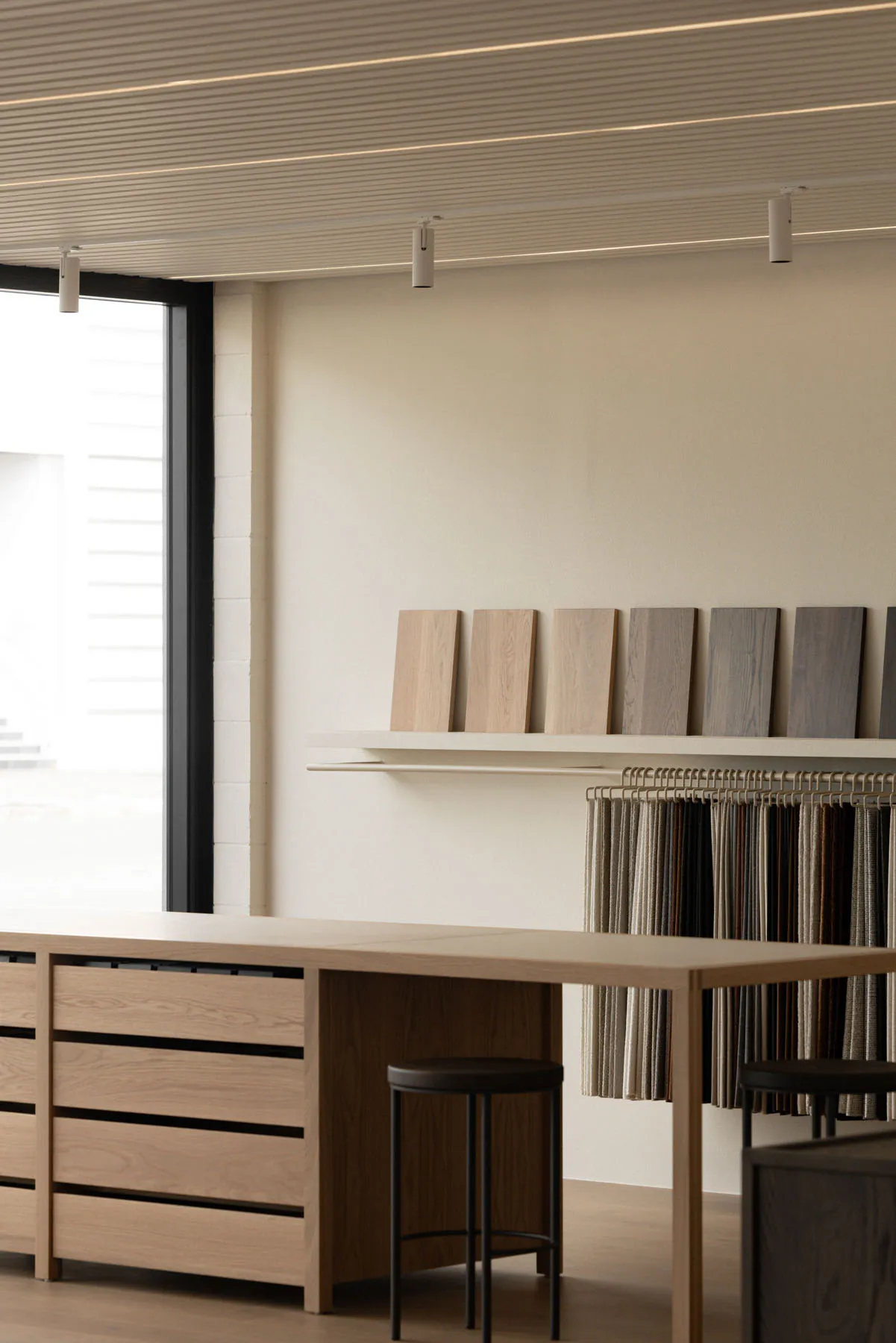 Various wood and textile samples arranged in an interior design setting.