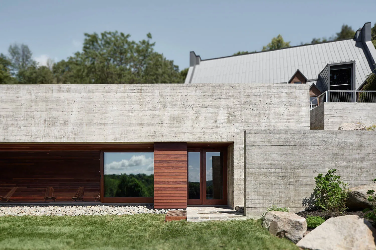 Modern architectural building with concrete exterior and wooden accents