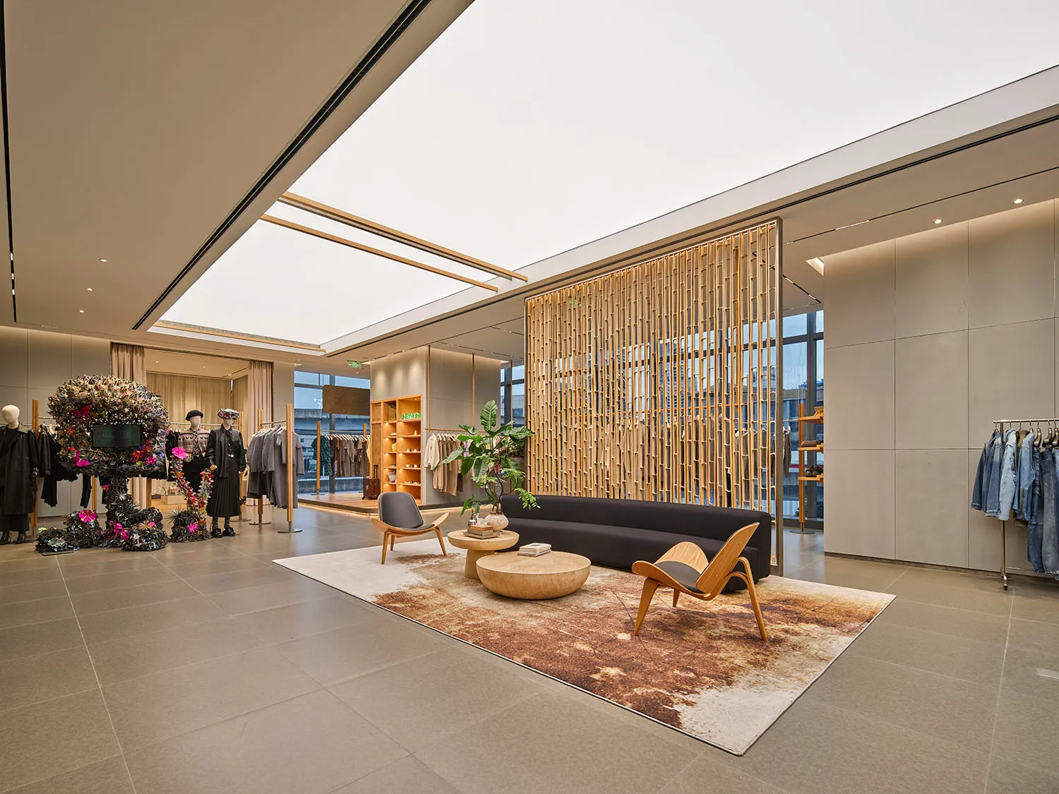 Industrial retail space featuring concrete, wood, and glass materials and design