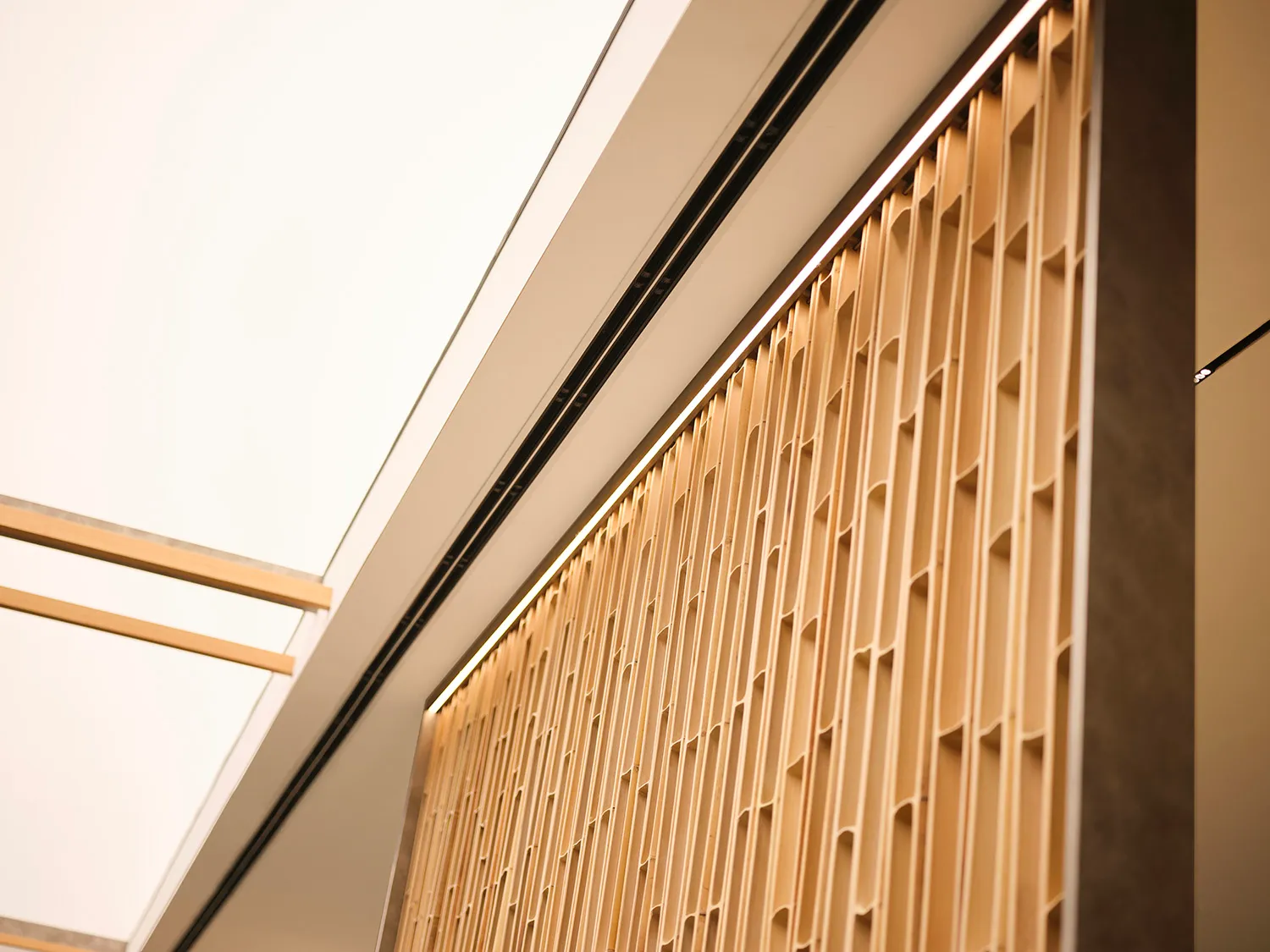 Modern interior design featuring sleek, geometric wooden panels.