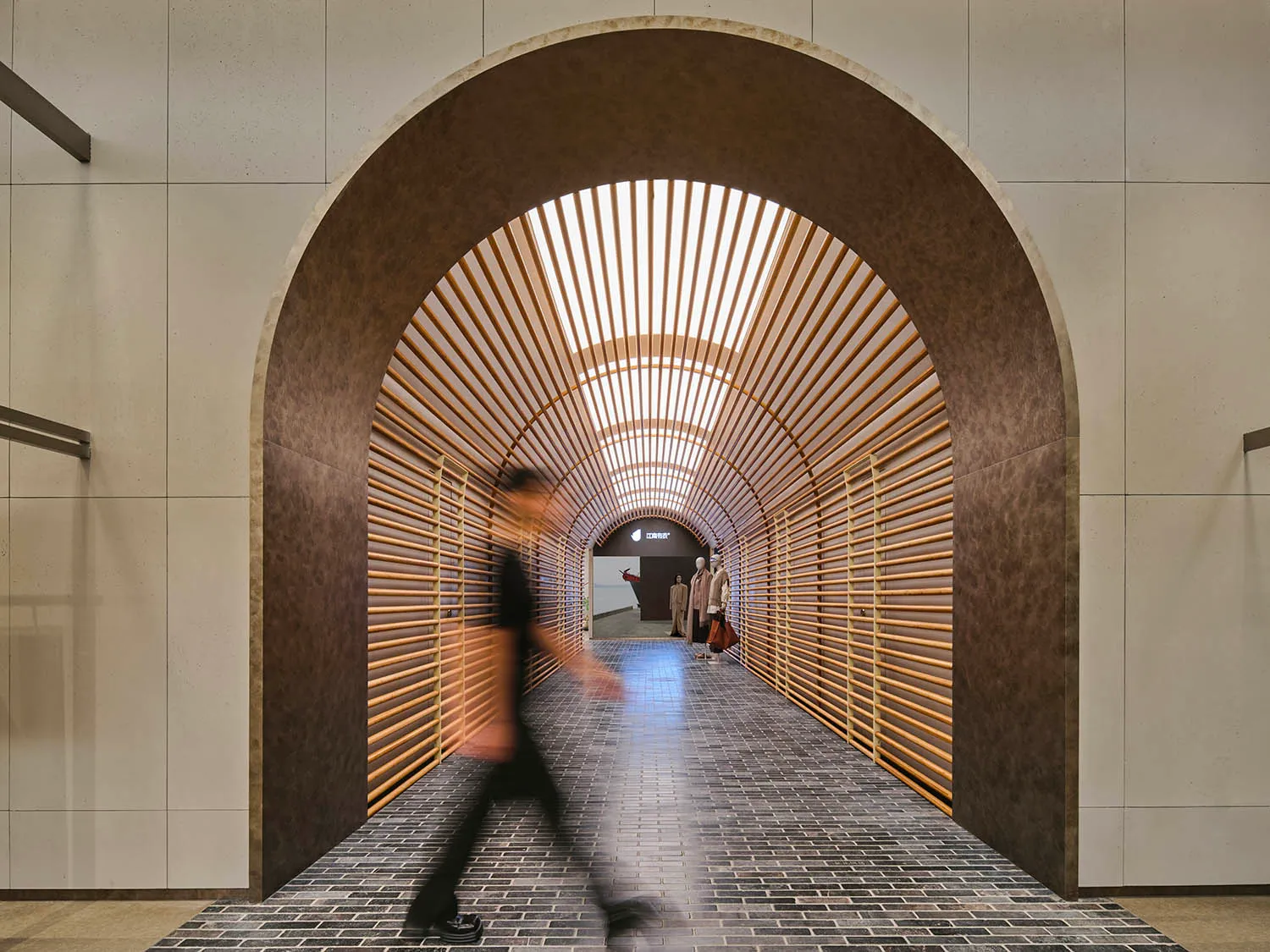 A minimalist tunnel with wooden slats.