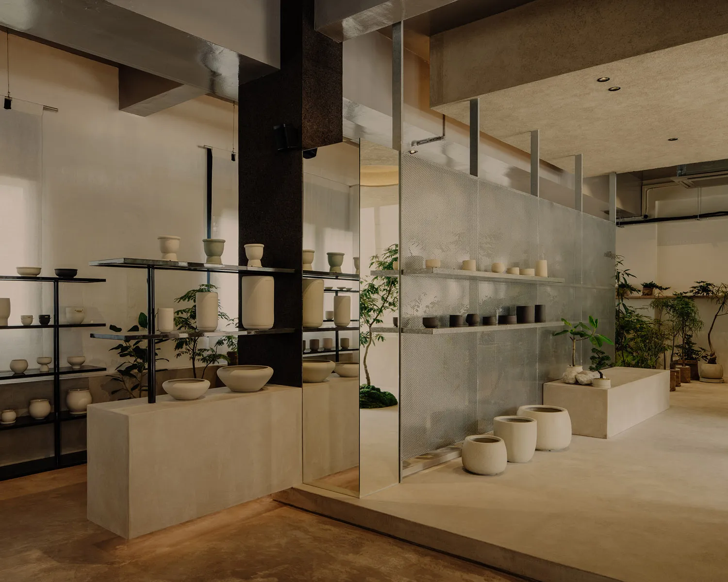 A modern architectural ceramic showroom with minimalist design and concrete and wooden finishes.