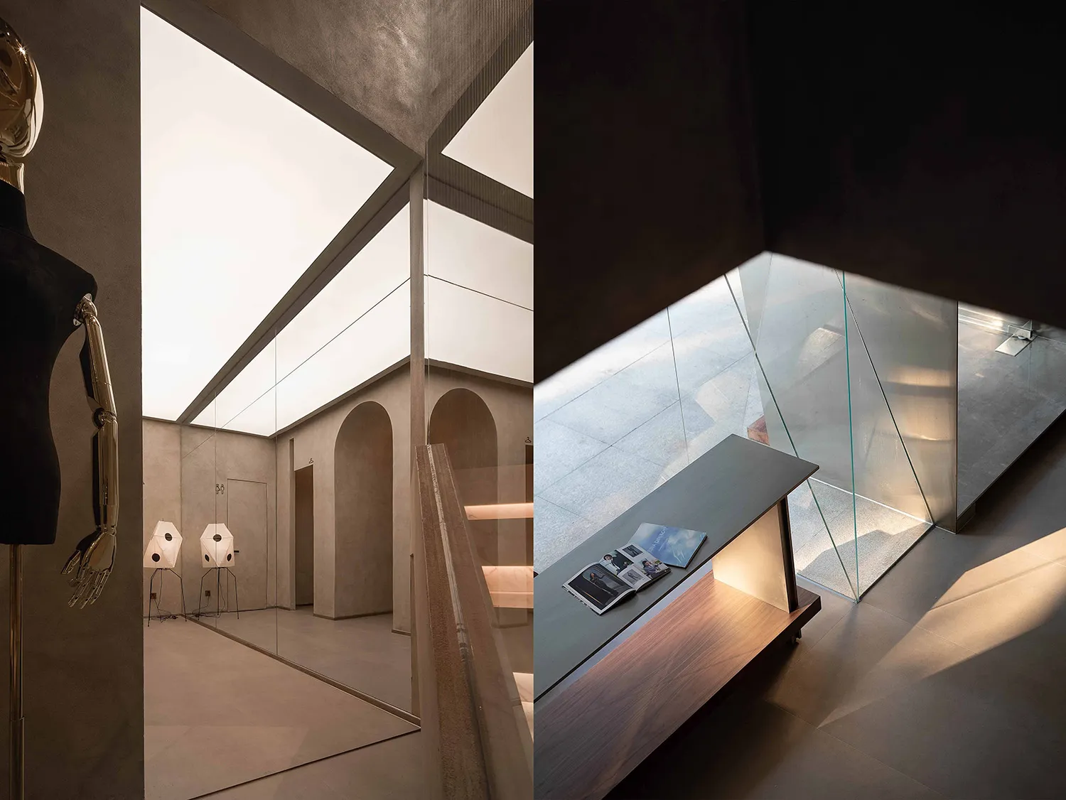 Modern industrial style library featuring grey concrete walls, glass walls, and large windows.