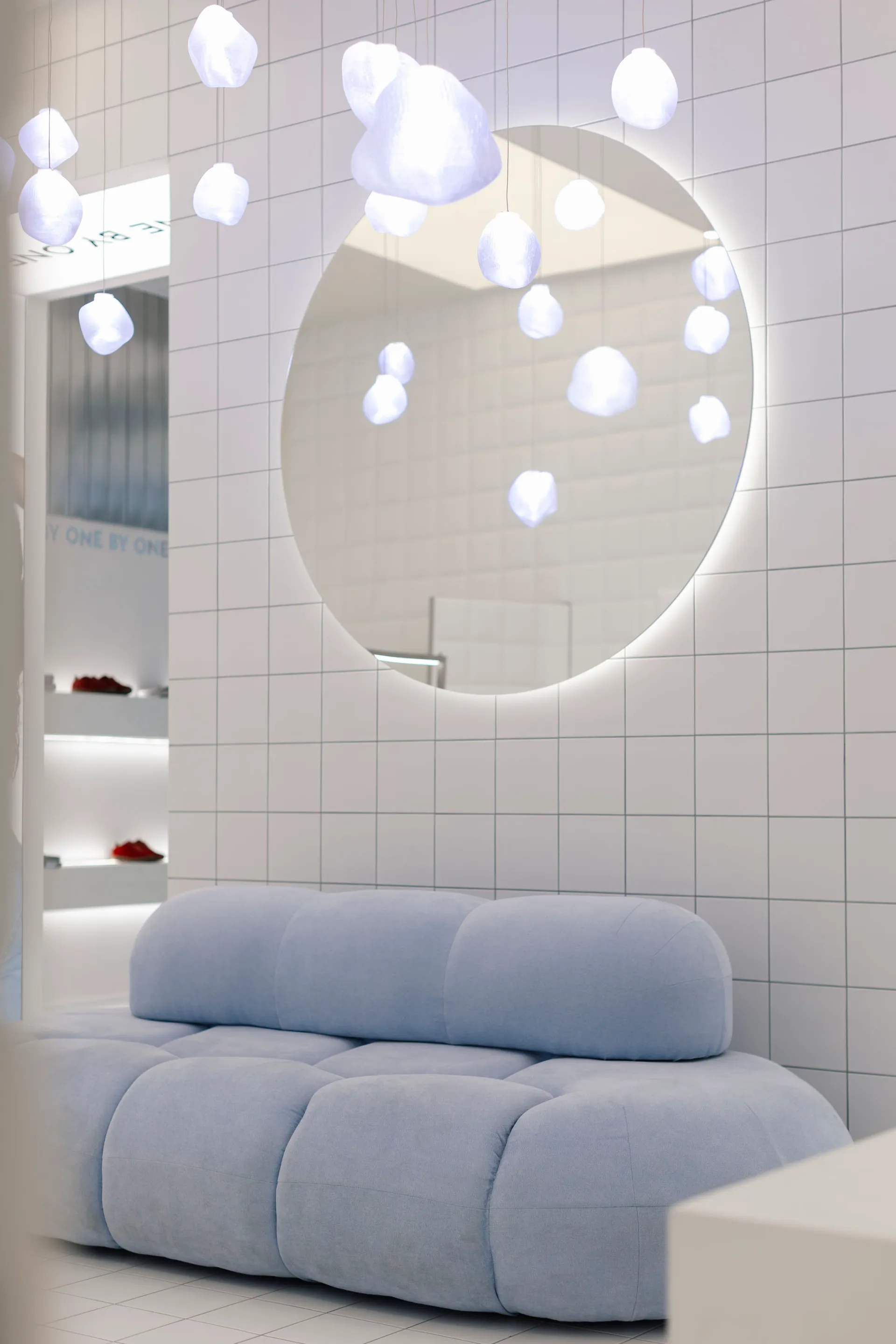 Modern interior featuring fabric, glass, and metal elements