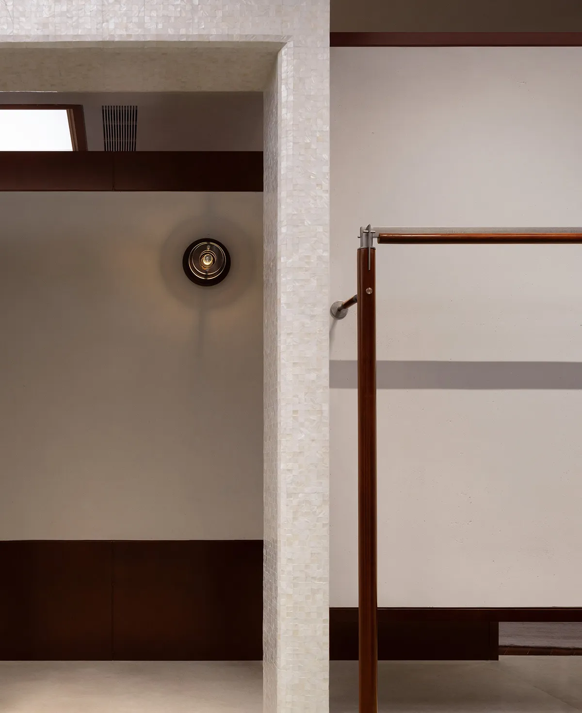 A modern interior design with white marble elements and minimalist fixtures.