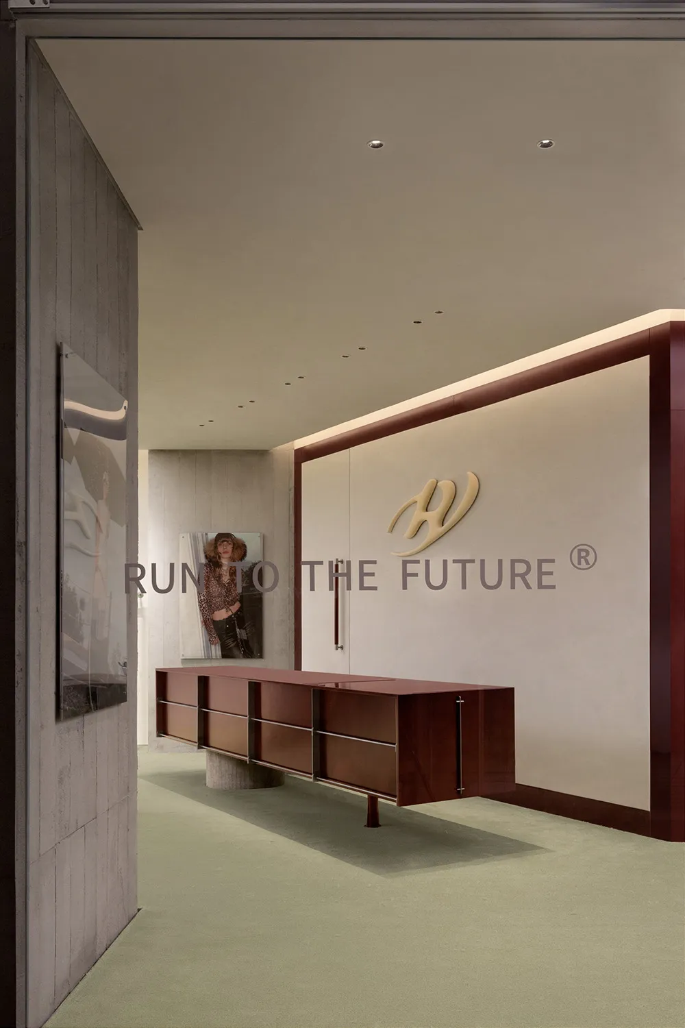 Modern office space featuring metallic furniture on green carpeting.