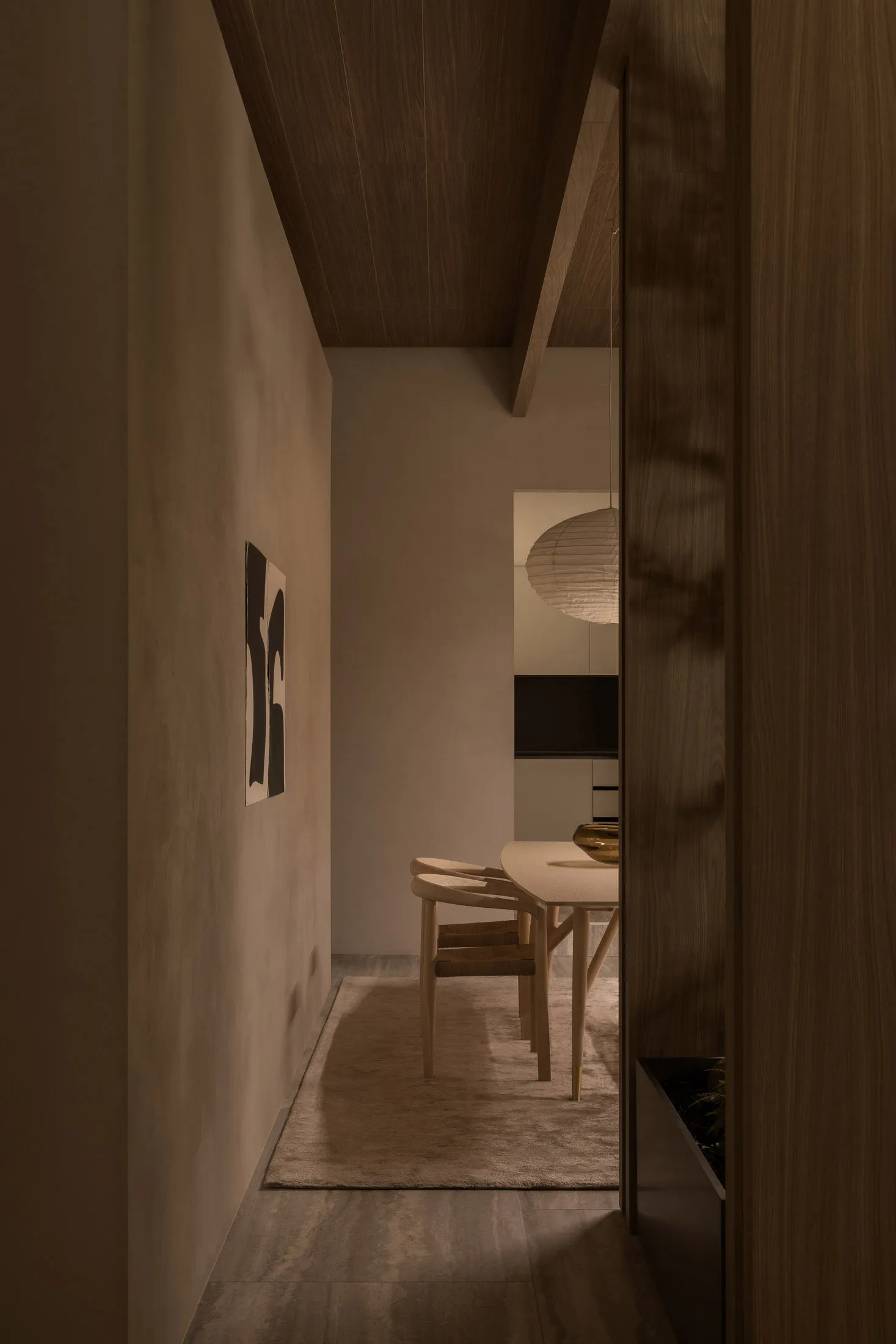 A minimalist residential interior featuring timber, concrete, and metal materials.