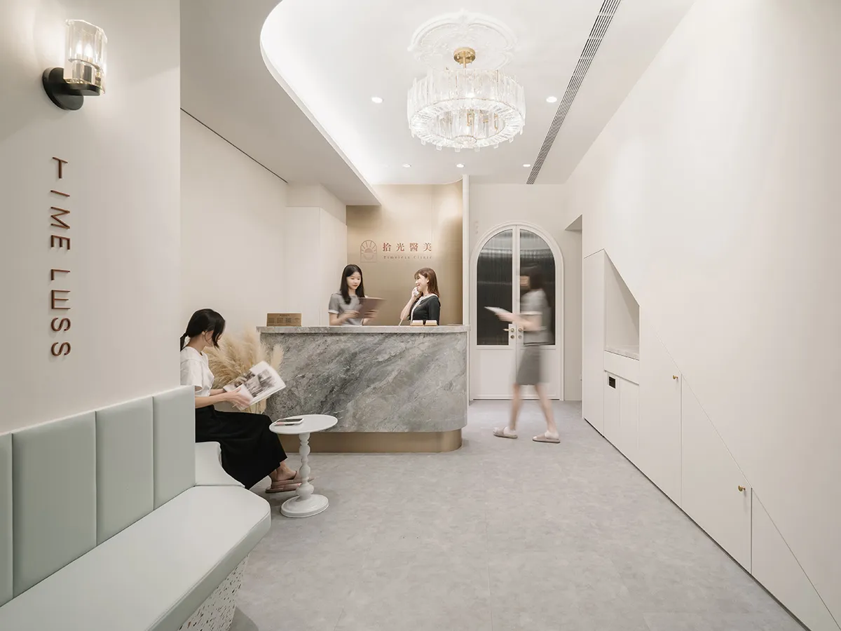 A reception desk made of marble and concrete materials.