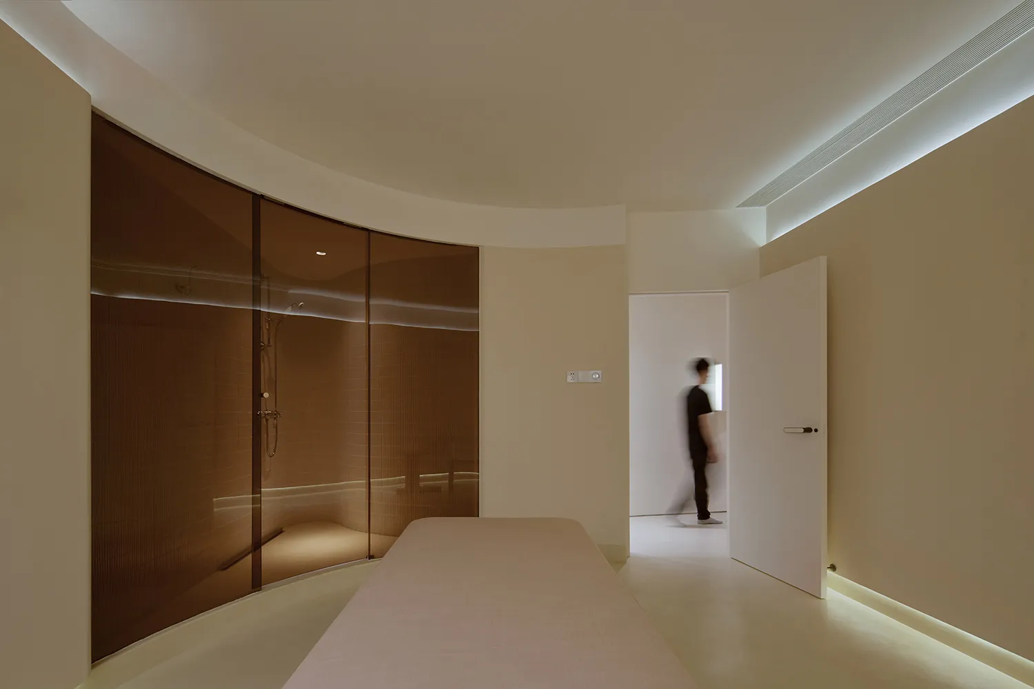 Minimalist bedroom featuring glass and concrete elements