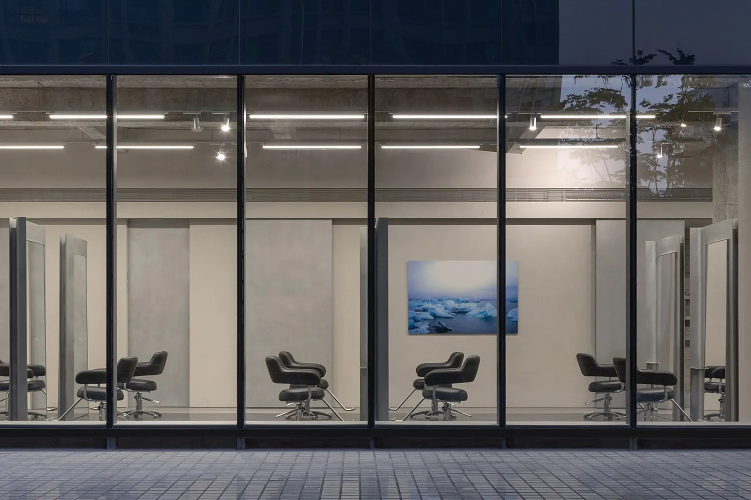 Storefront with glass, metal, and concrete materials