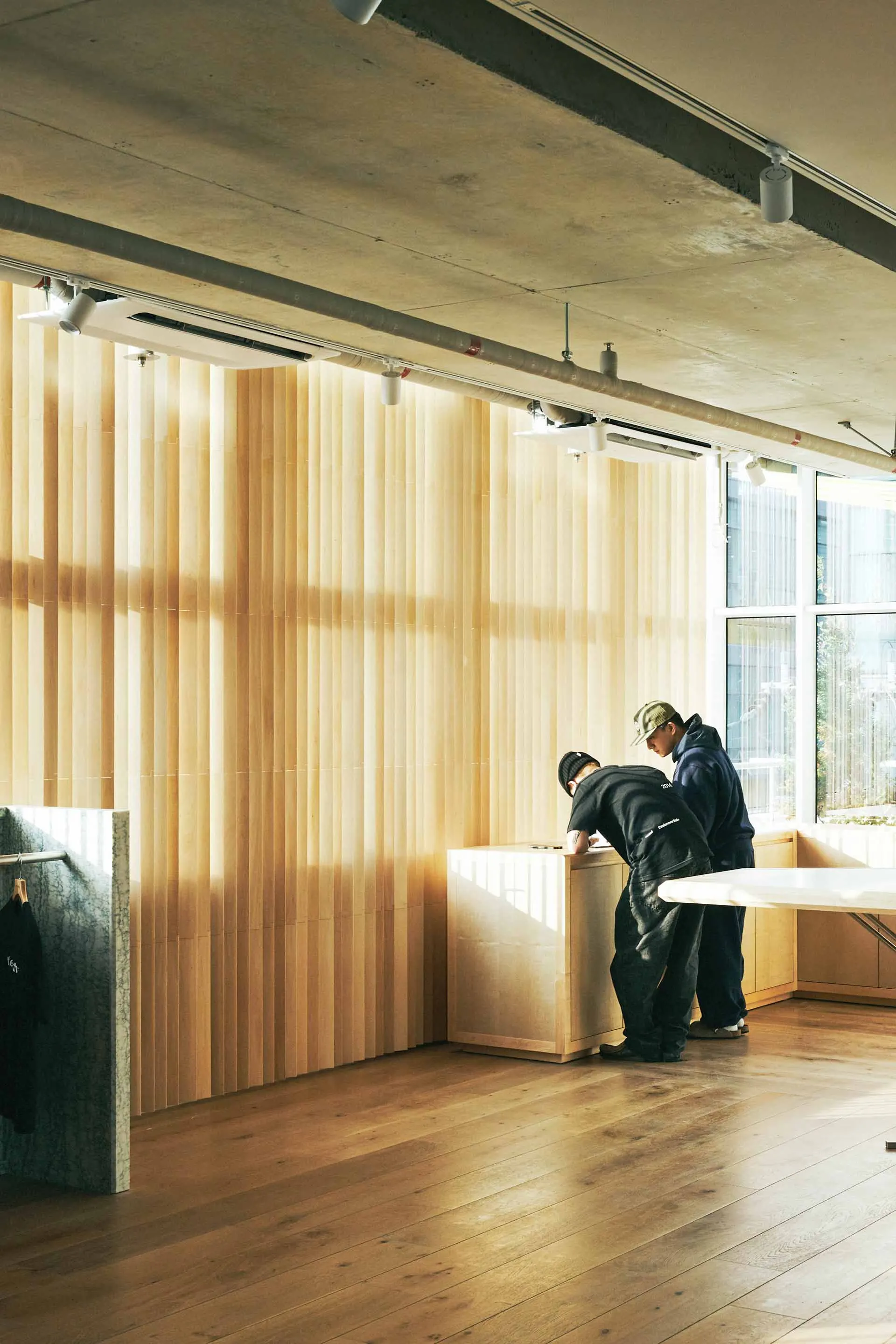 A modern retail storefront with wooden accents and an open, airy design.