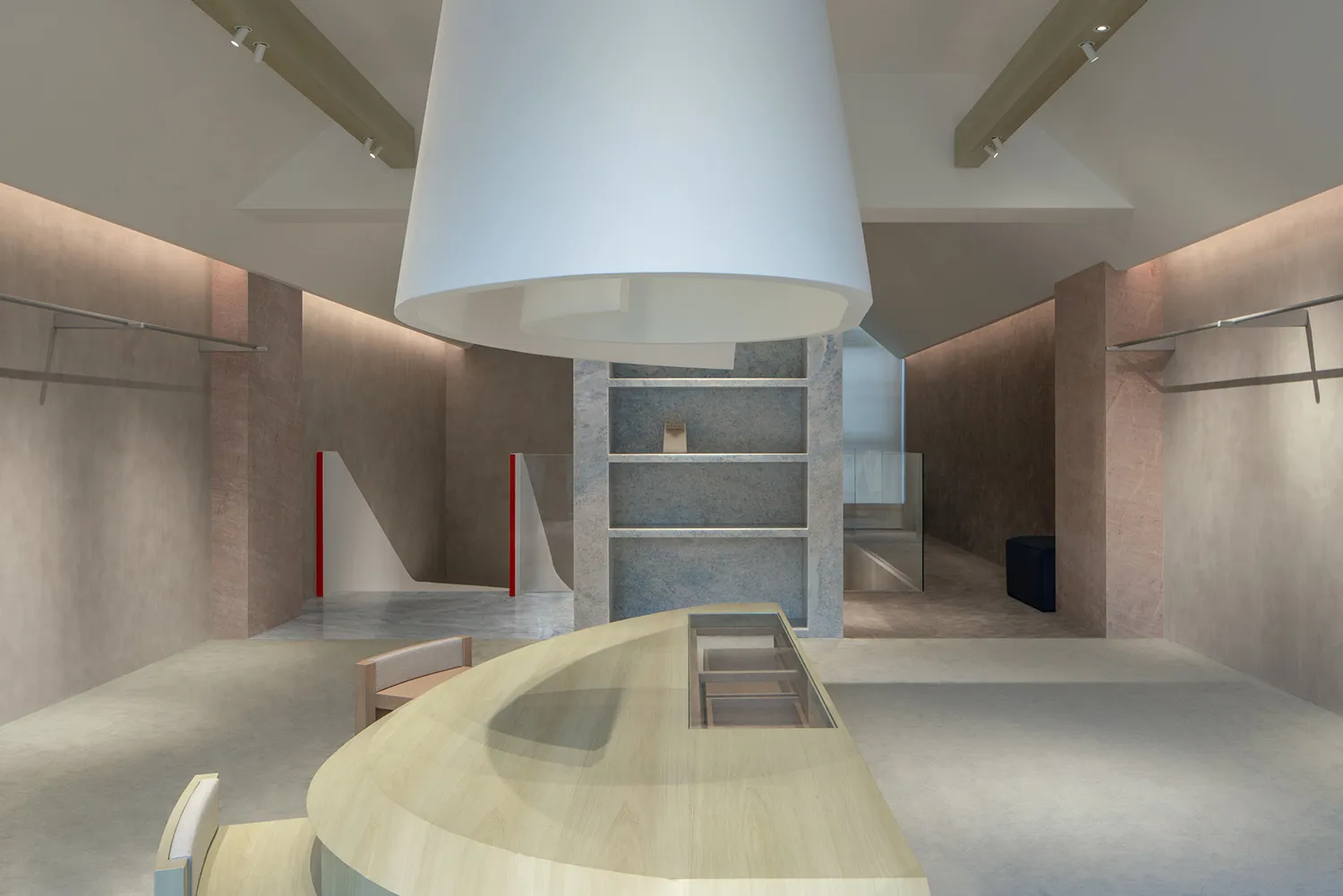 A modern retail storefront with wooden fixtures and concrete accents.