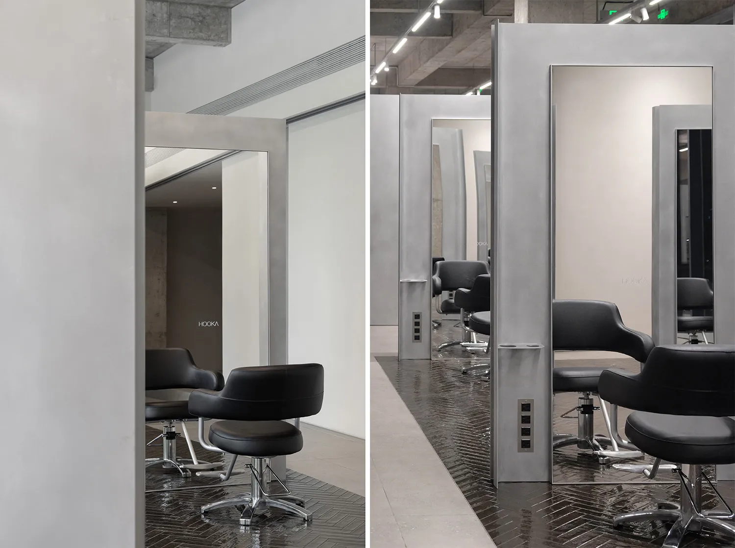 Modern salon interior featuring metal and glass fixtures with concrete flooring.