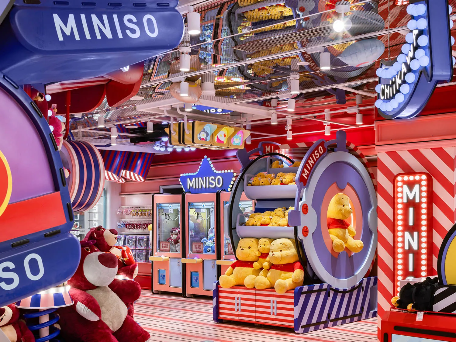 A colorful and playful retail store interior featuring various plush toys and decorative elements.