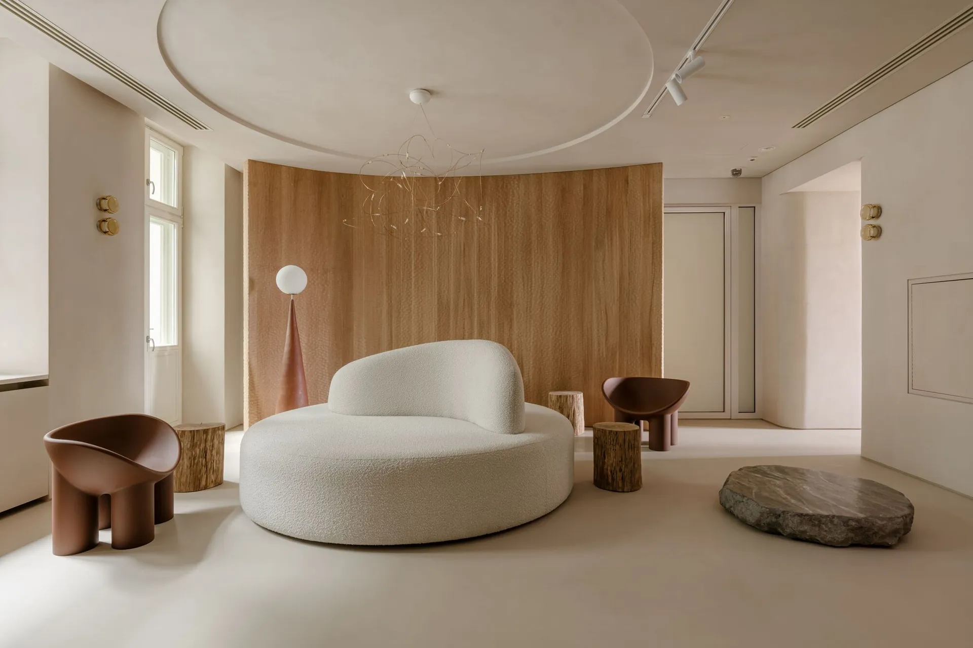 A minimalist modern reception area with a concrete and wooden design.