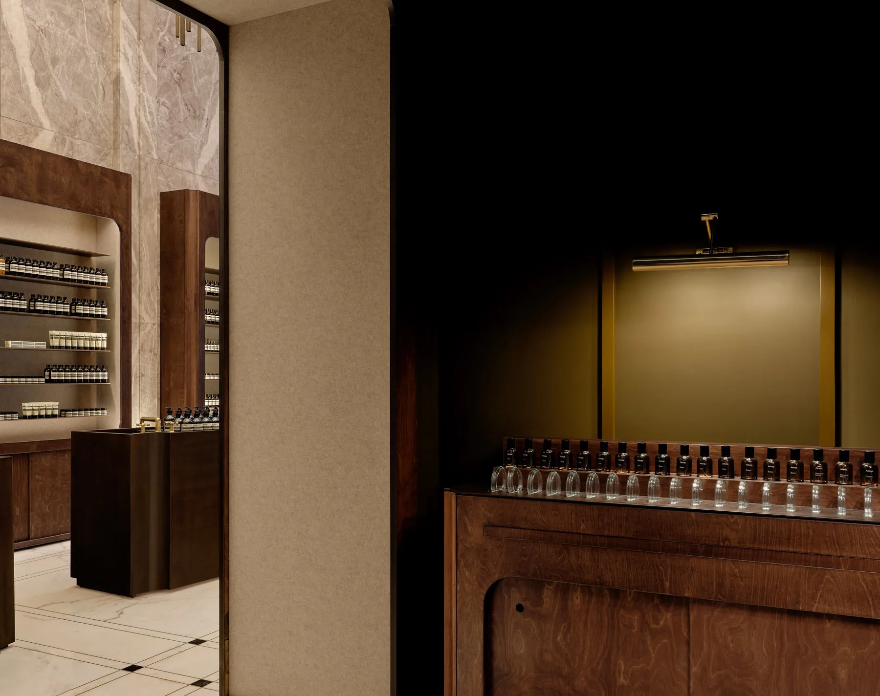 Modern retail storefront with marble, glass, and wooden elements.