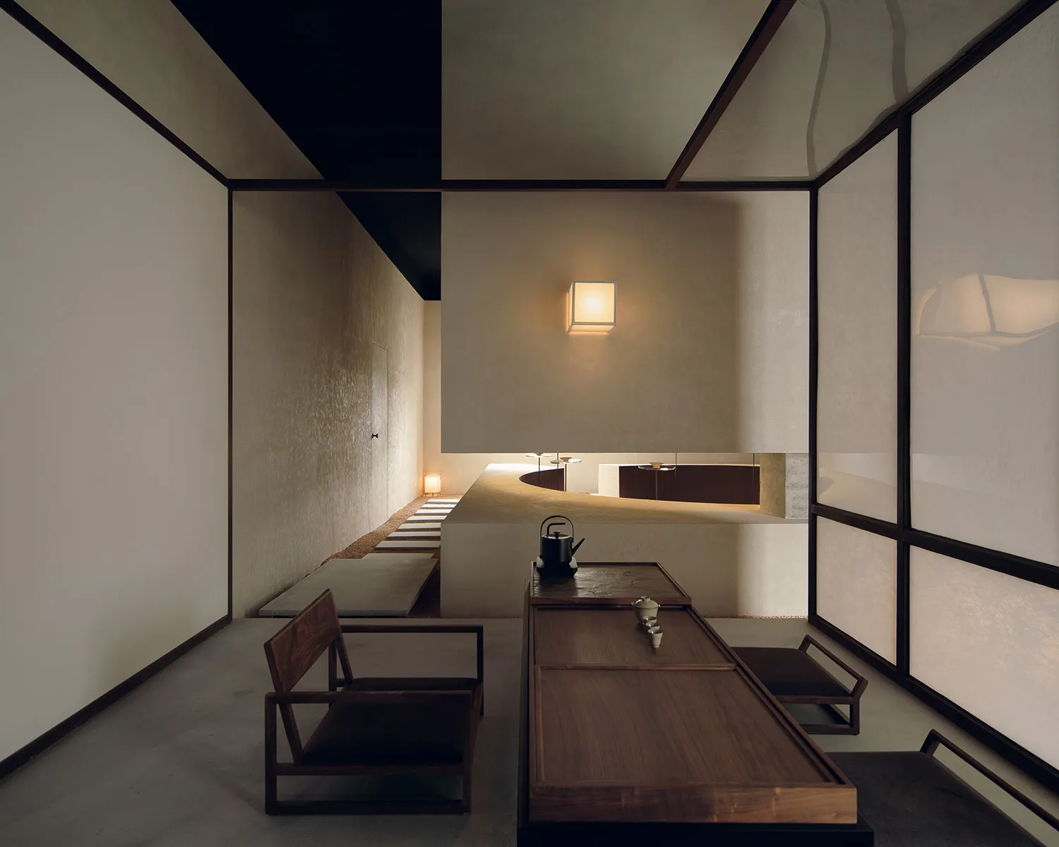 A modern tea room featuring concrete, paper, and wood materials.