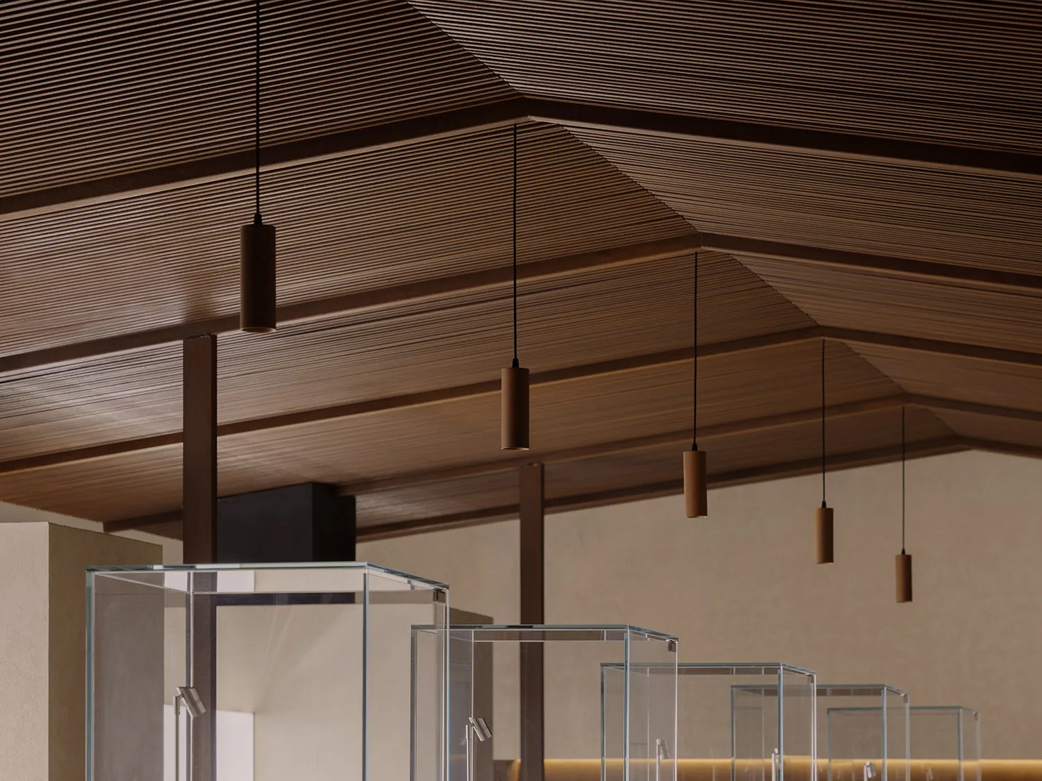 Minimalist interior design featuring a wooden ceiling with horizontal slats.