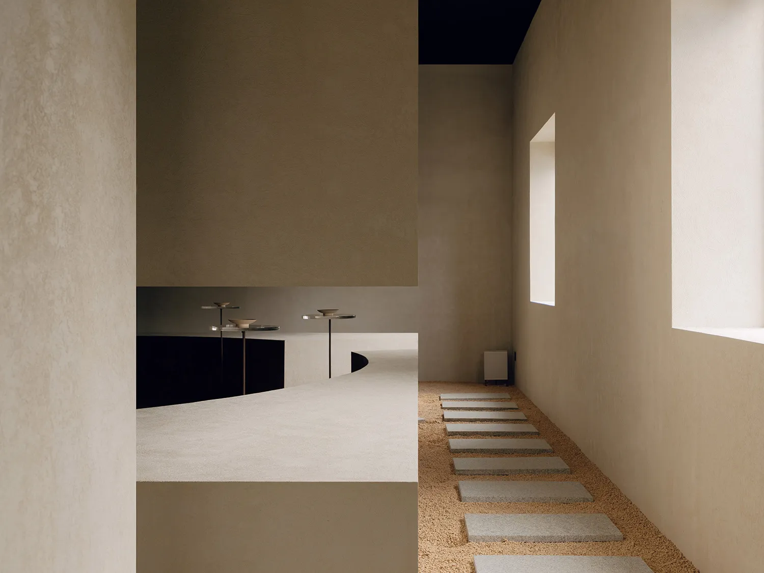 Stone steps leading into a minimalist architecture space