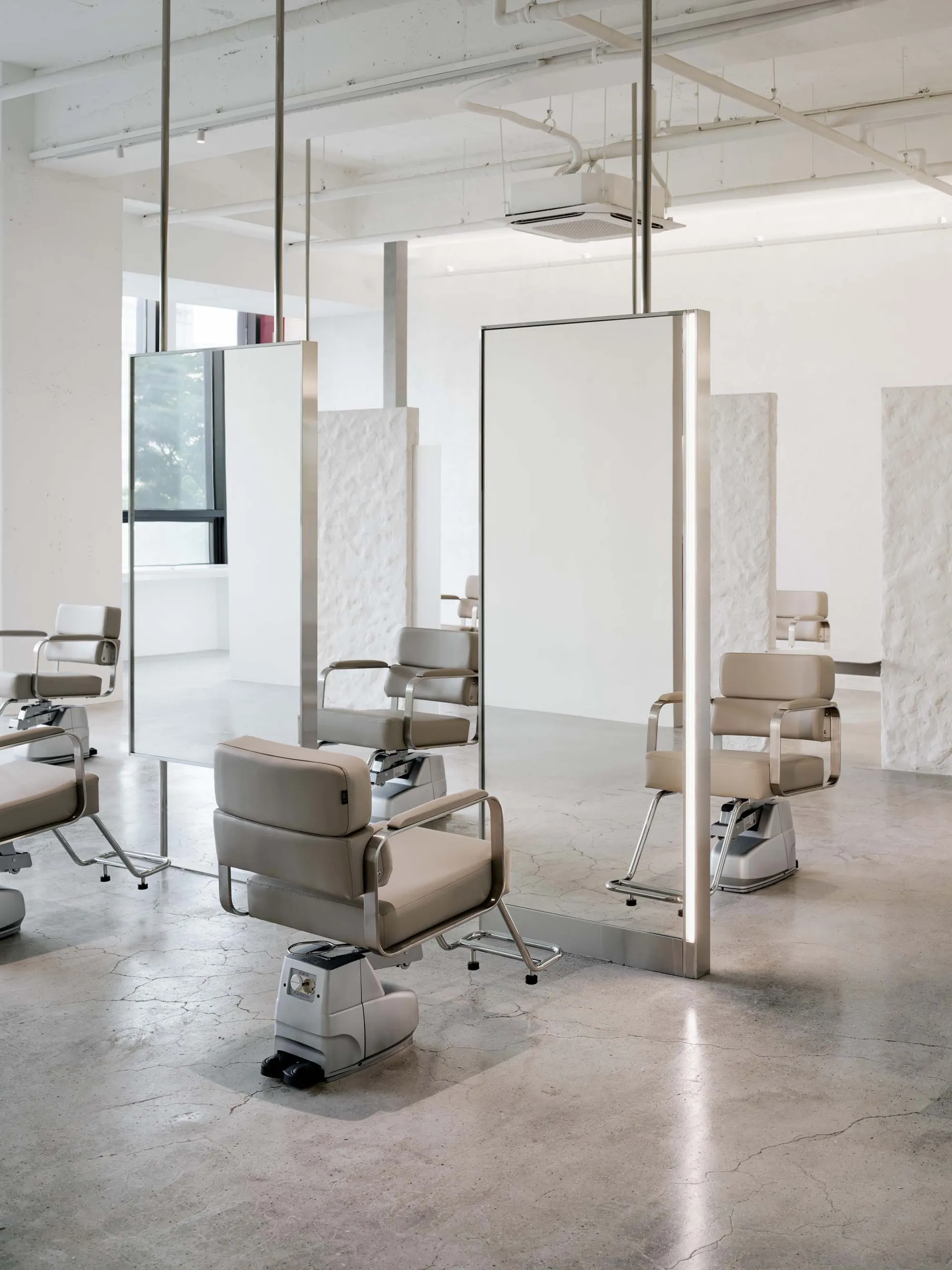 Modern salon interior featuring metallic styling and furniture