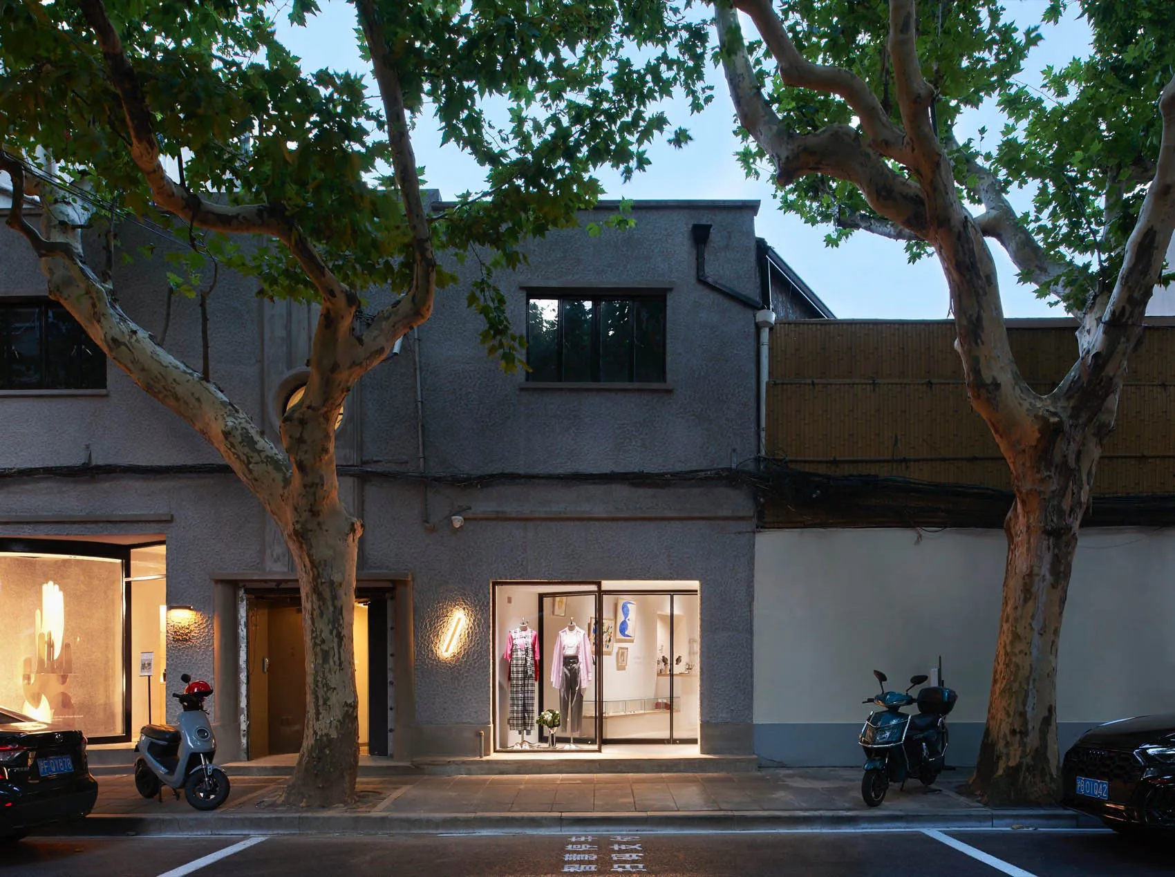 Modern retail storefront with glass and concrete storefront display