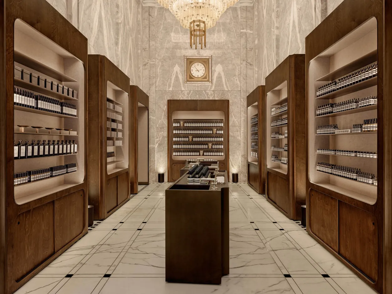 A modern retail store interior featuring wooden shelves and marble flooring.