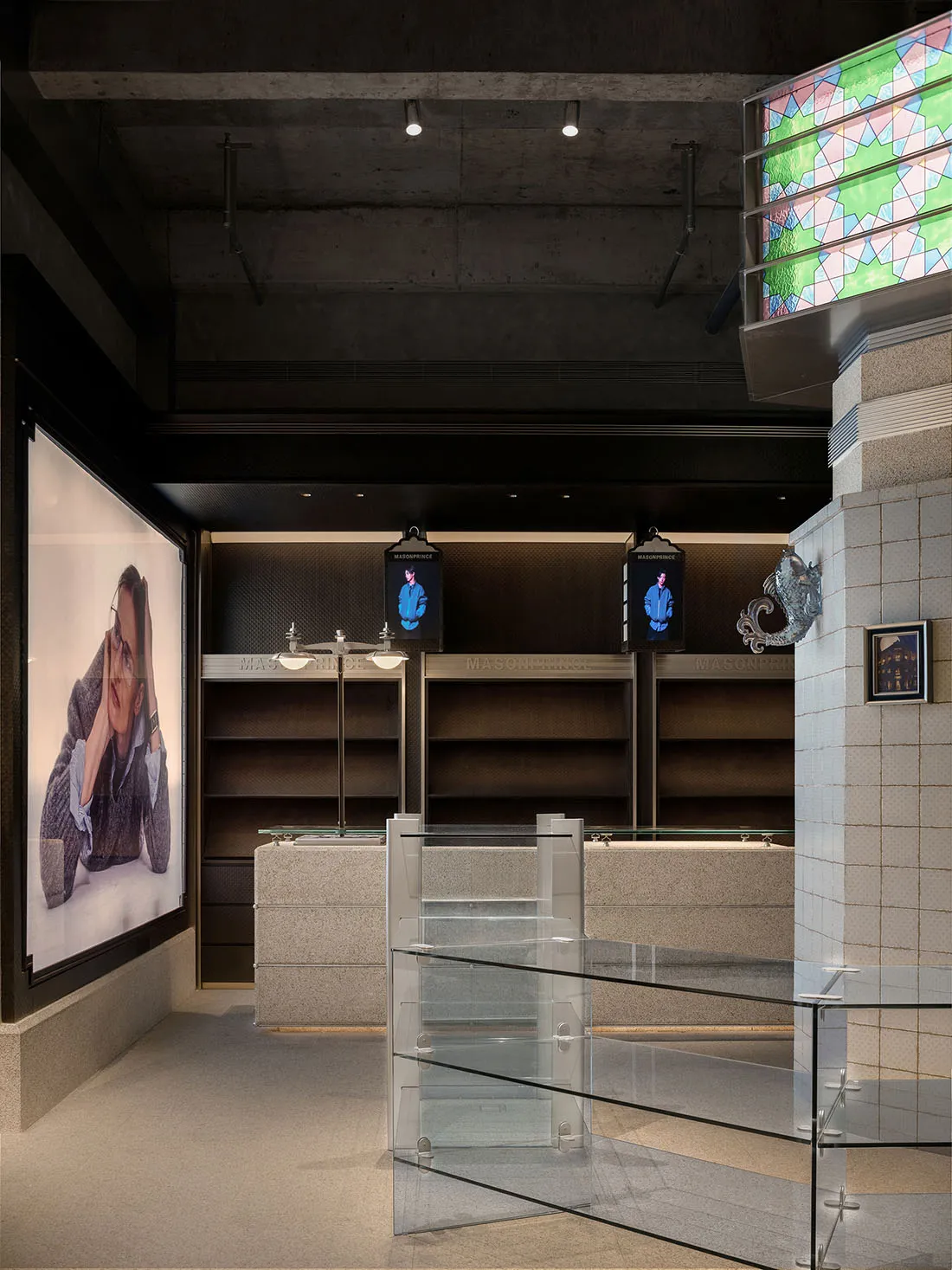 Modern retail store interior with concrete and glass elements.