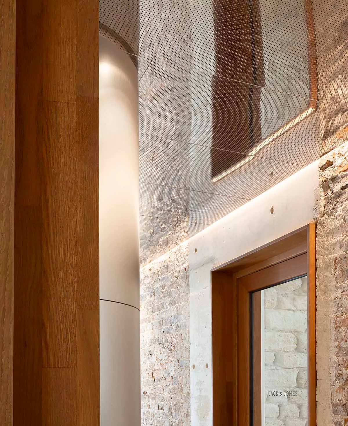 A modern storefront with concrete walls and a sleek, minimalist design.
