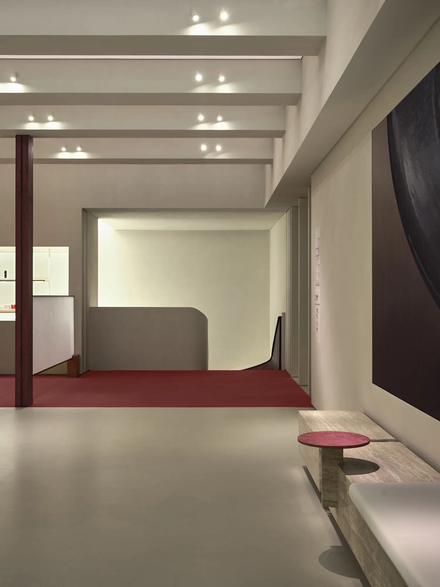 Modern interior design featuring concrete walls and floors in a lobby setting.
