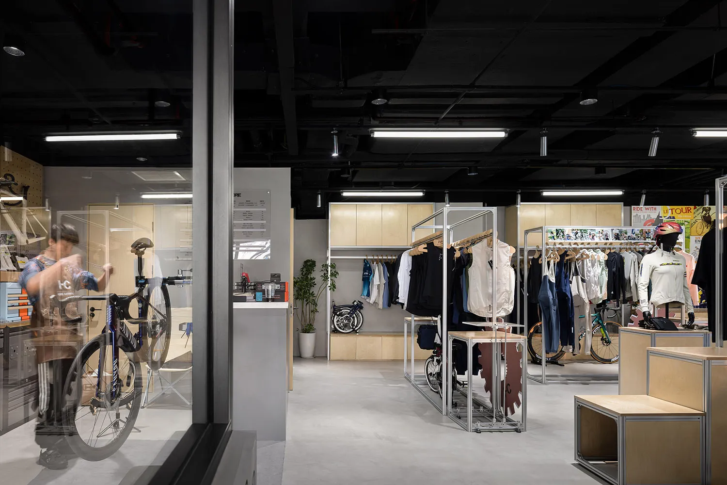 Fashion store displaying clothing on racks and shelves in a minimalist design
