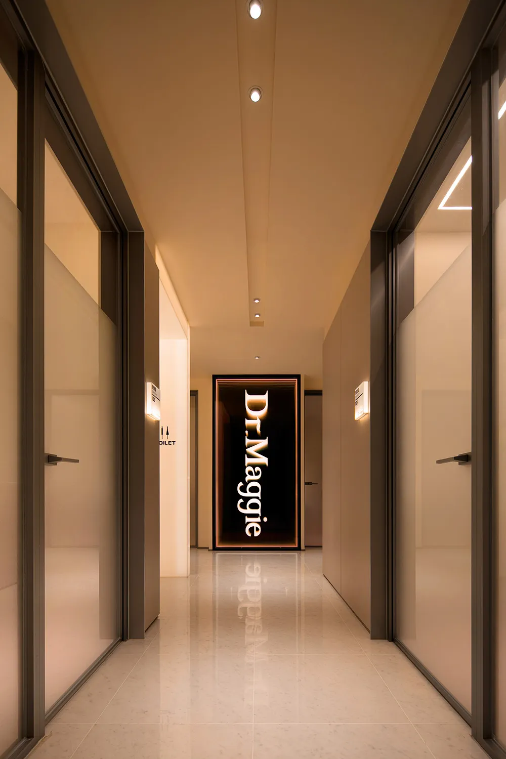 Modern interior corridor with white marble flooring and glass walls