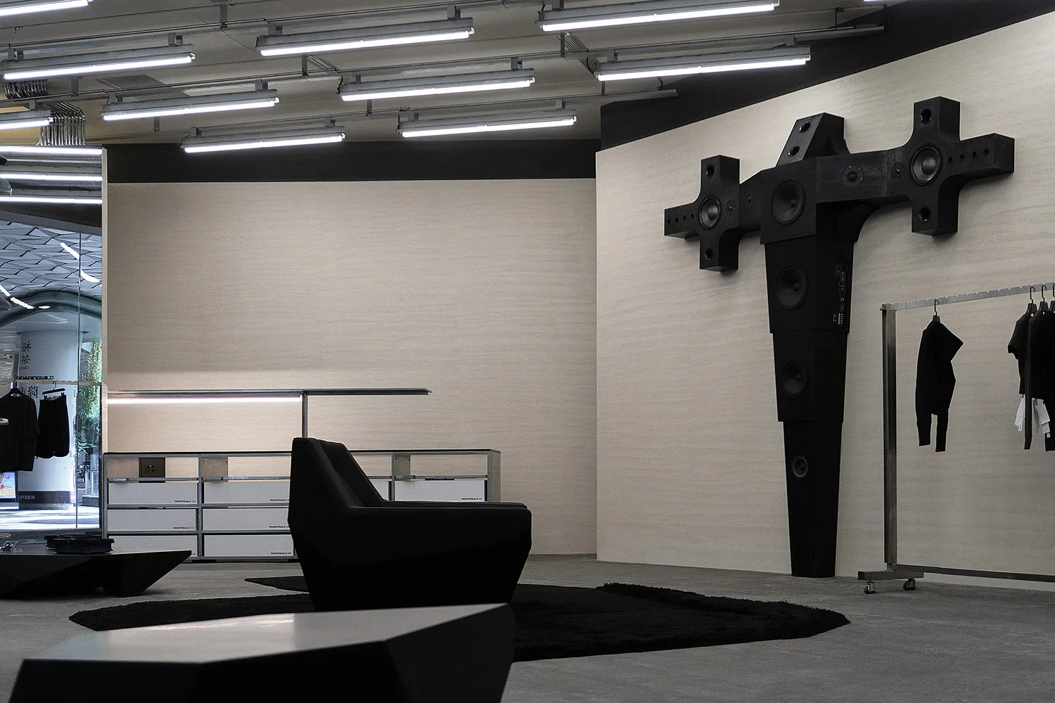Modern retail store with black metal accents and concrete floor