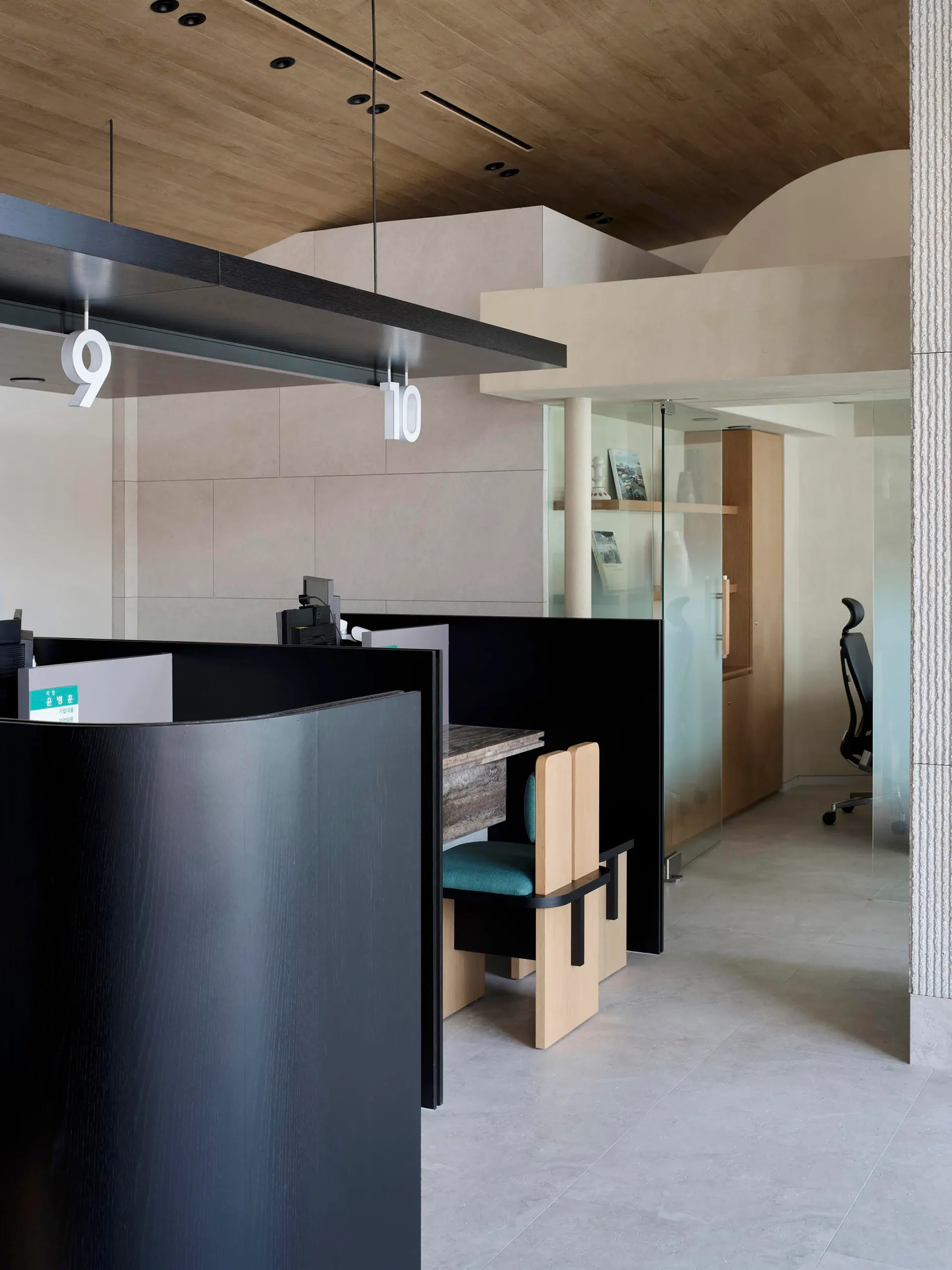 A modern office space featuring minimalist design principles and contemporary materials.