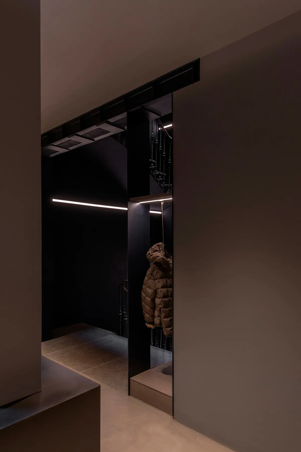Clothing shop with a modern metal entryway and minimalist design.