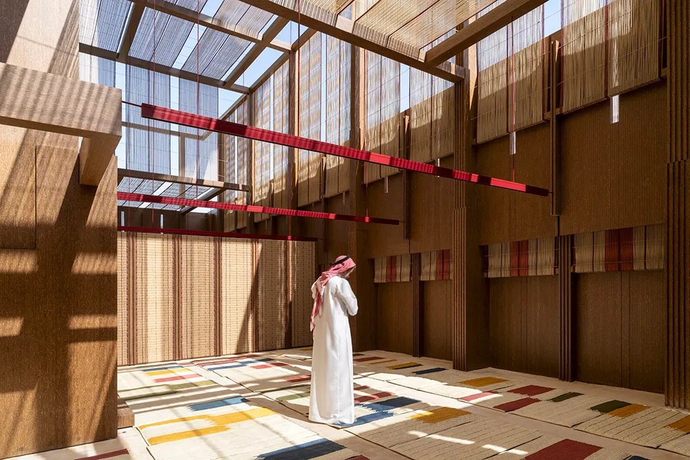 A minimalist interior design featuring wooden panels and colorful geometric patterns on the floor.