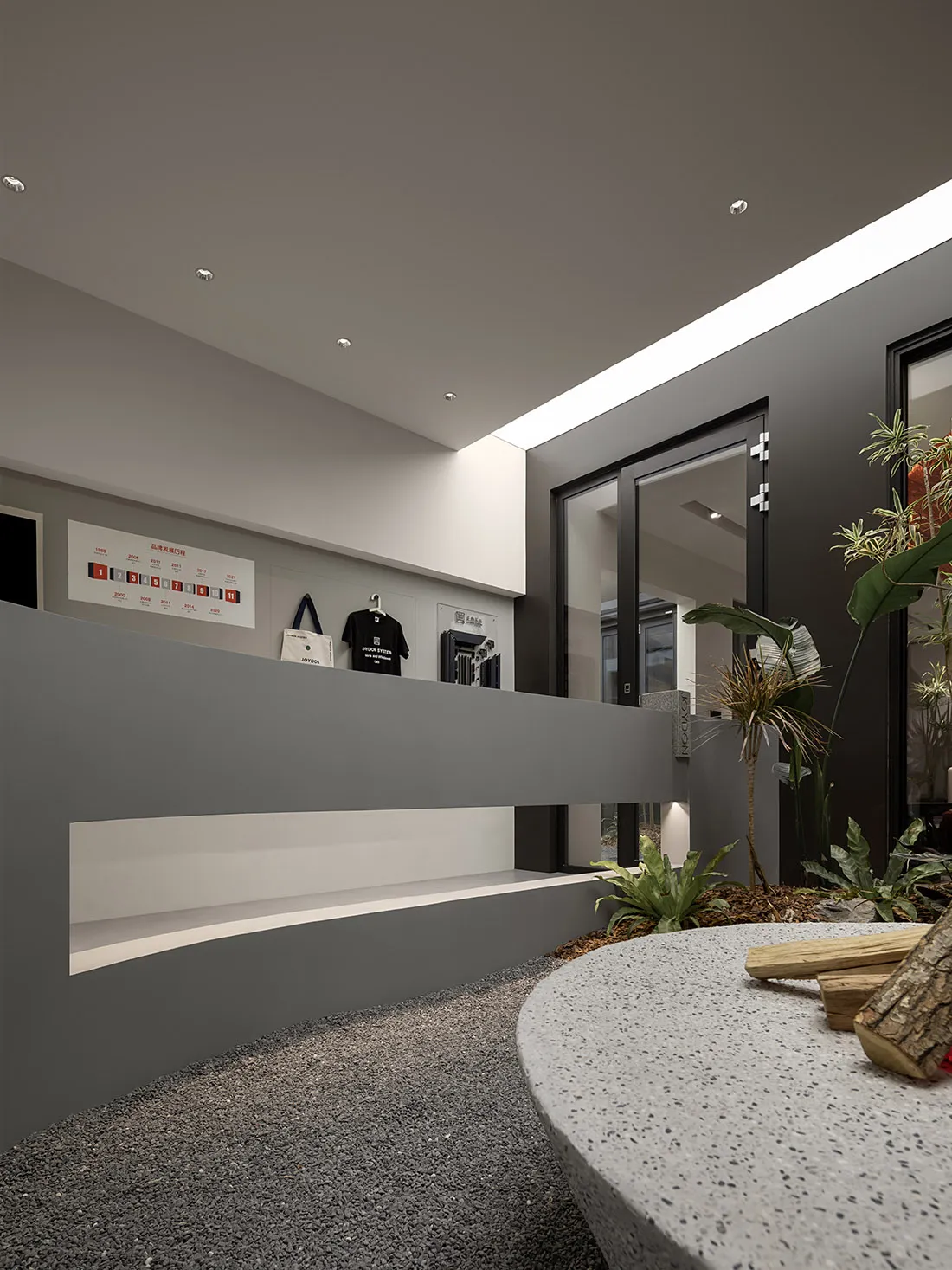 Industrial retail storefront showcasing modern concrete and terrazzo elements.