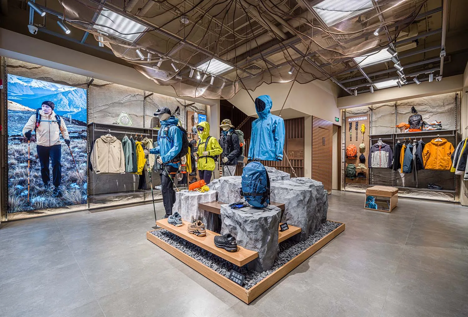 Modern retail store display featuring outdoor clothing and accessories