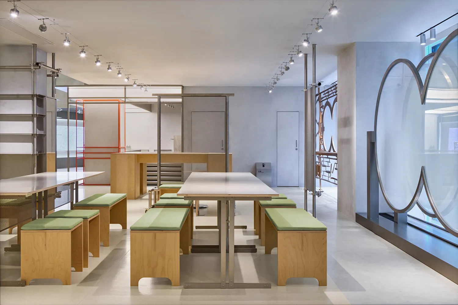 Modern coffee shop with wooden tables and metal benches