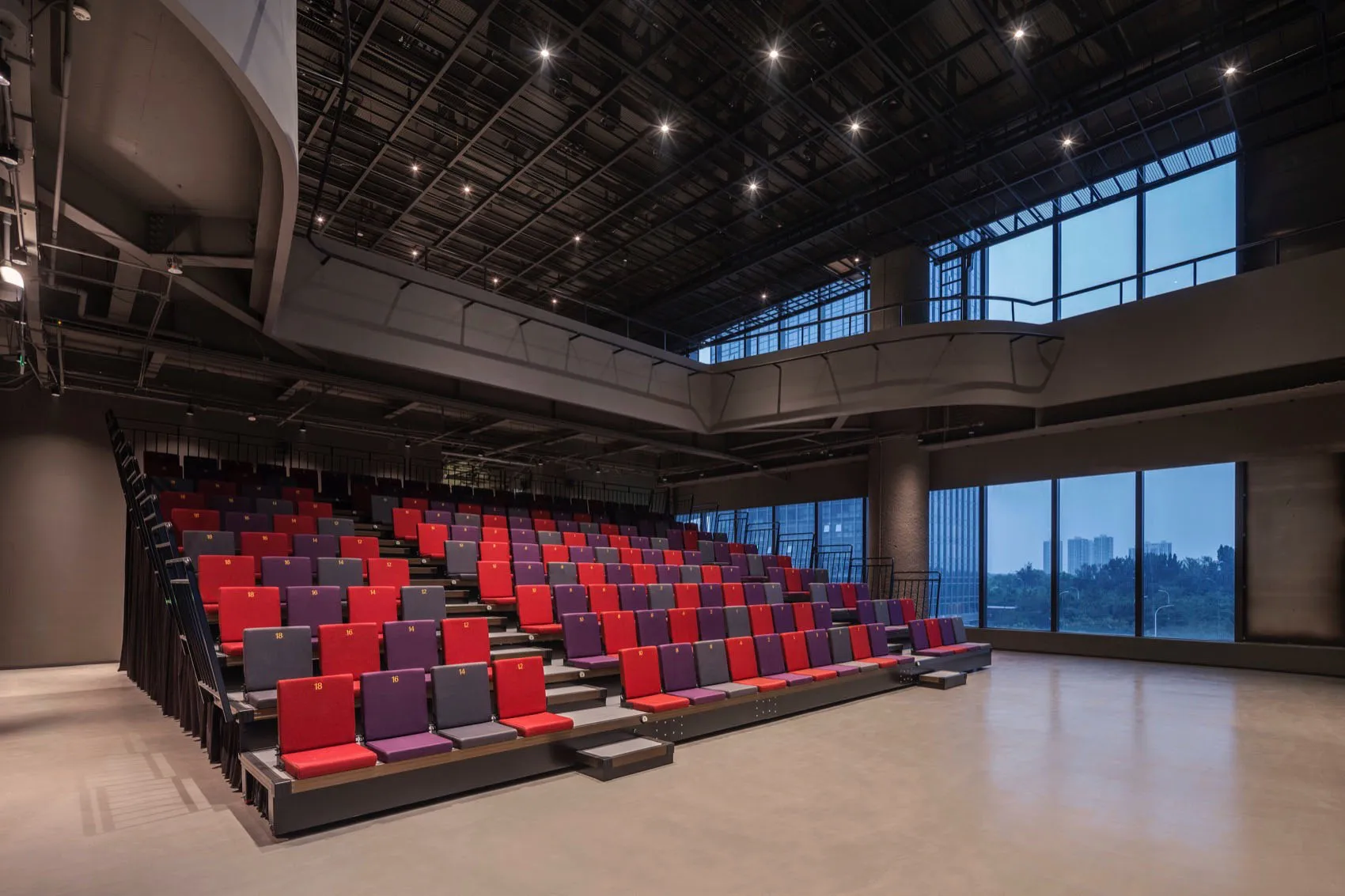 A modern conference room featuring metal and fabric elements.