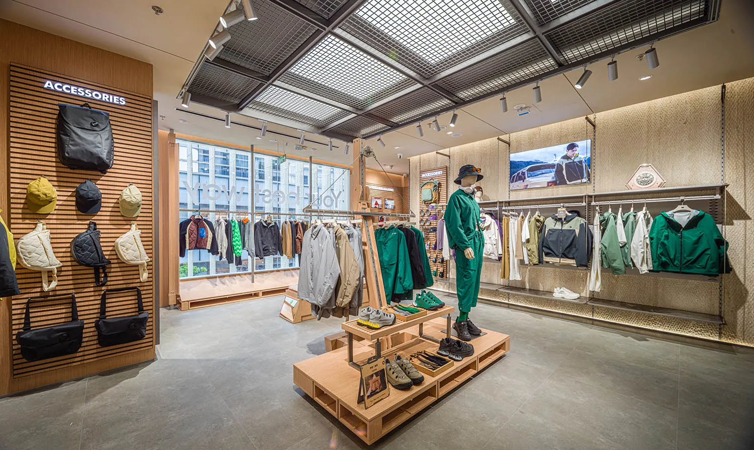 A retail clothing store showcasing various garments and accessories arranged on shelves and racks.