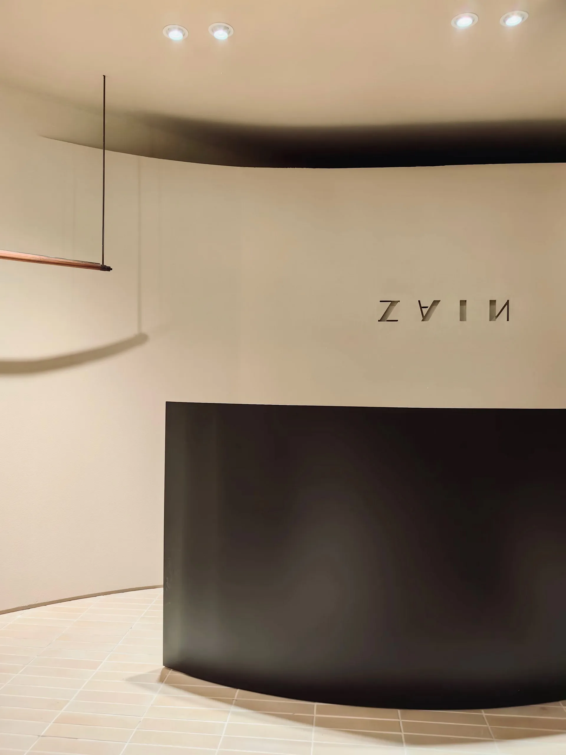 A modern reception desk with a metal frame.