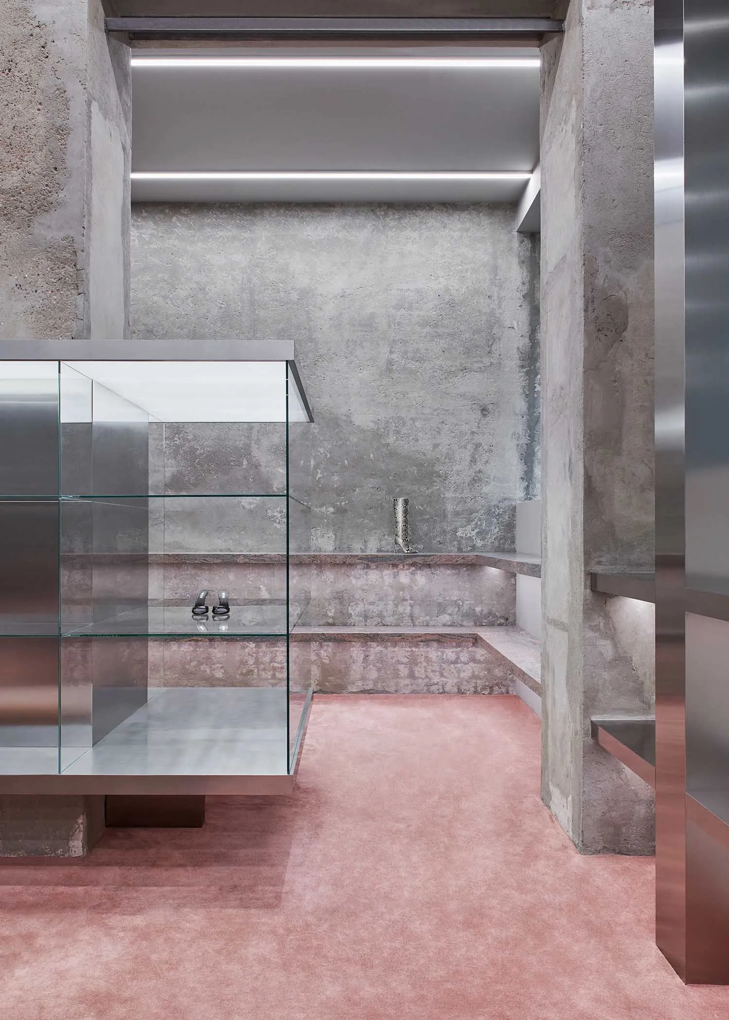 Modern showroom interior with concrete and glass materials