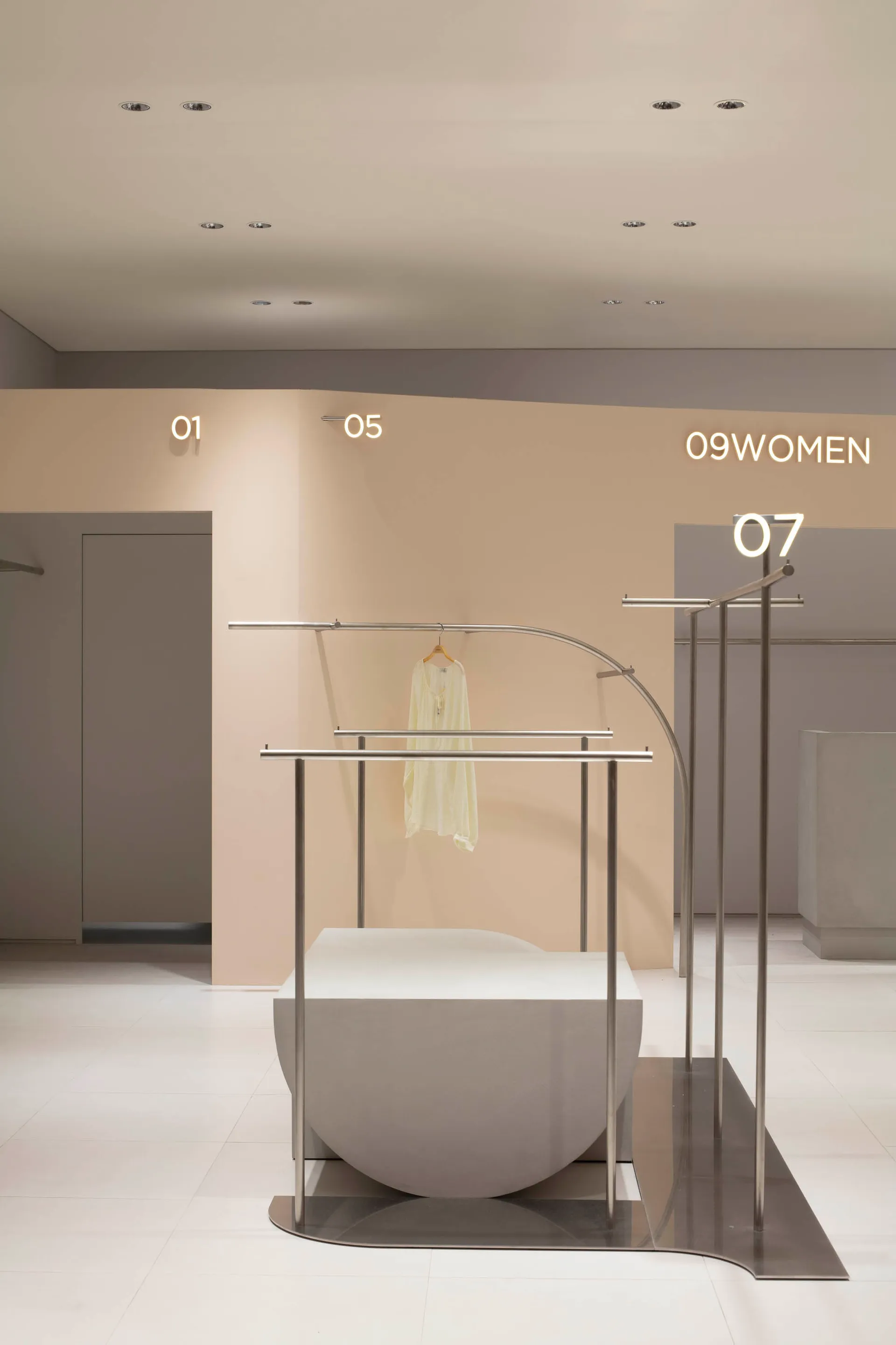 Modern retail store display featuring metal racks and signage.