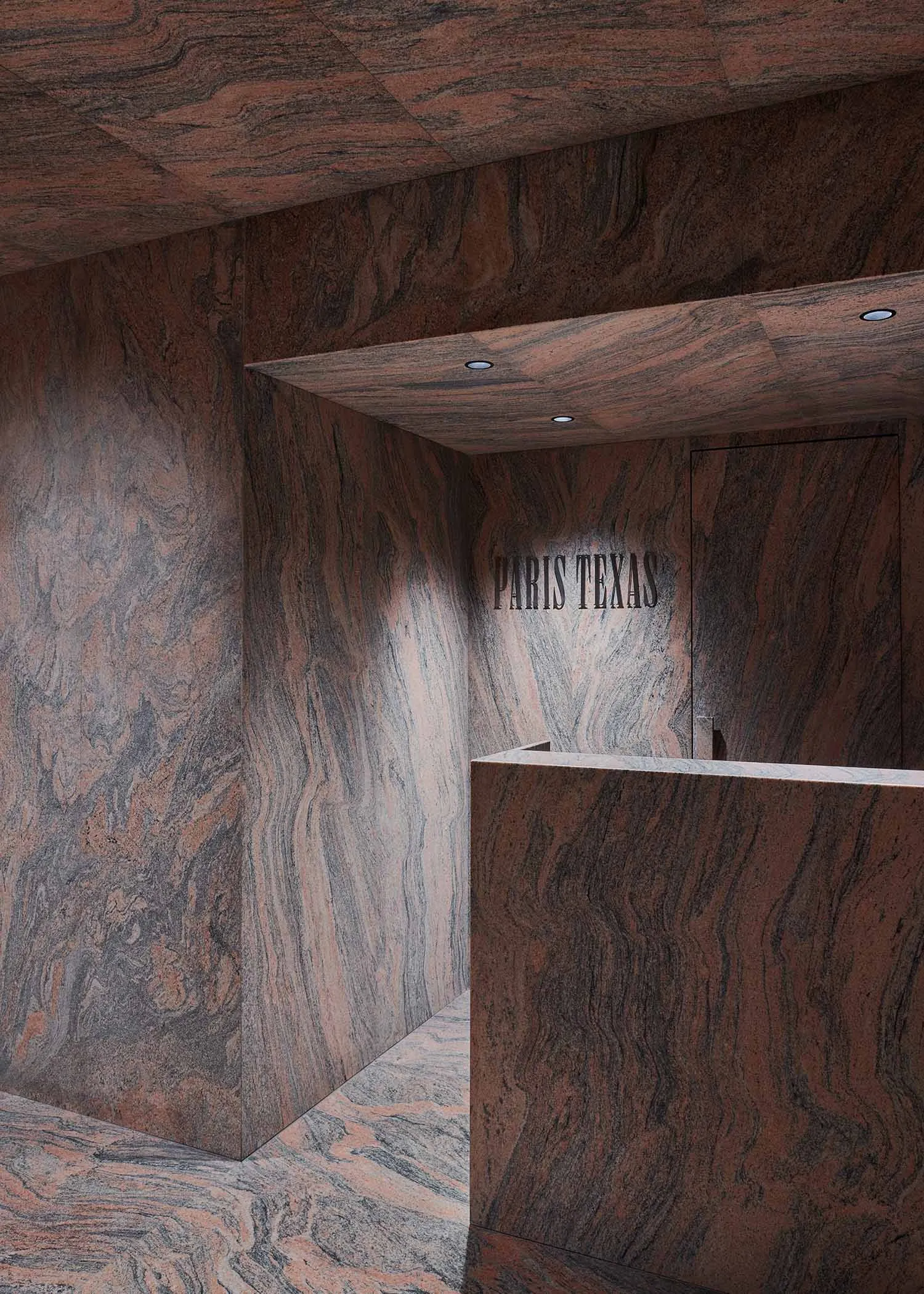 The interior of a space made of granite with a sign that says 'Paris Texas'.