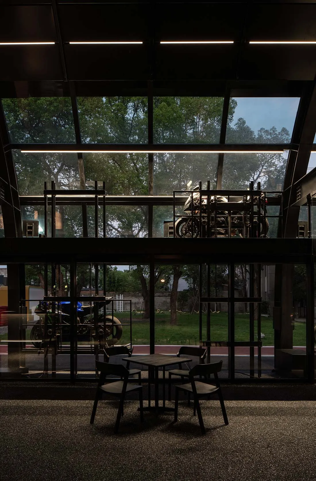 Industrial-style cafe interior featuring metal detailing and tables.