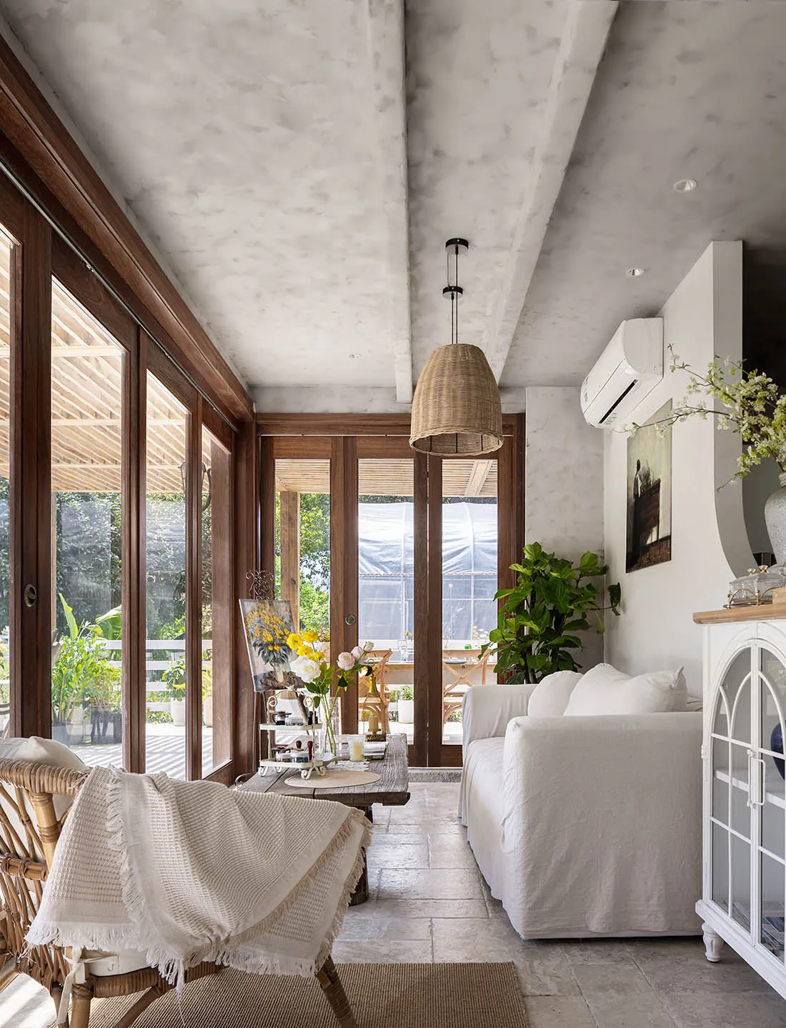 A minimalist living room with wooden furniture, white accents, and a cozy atmosphere.