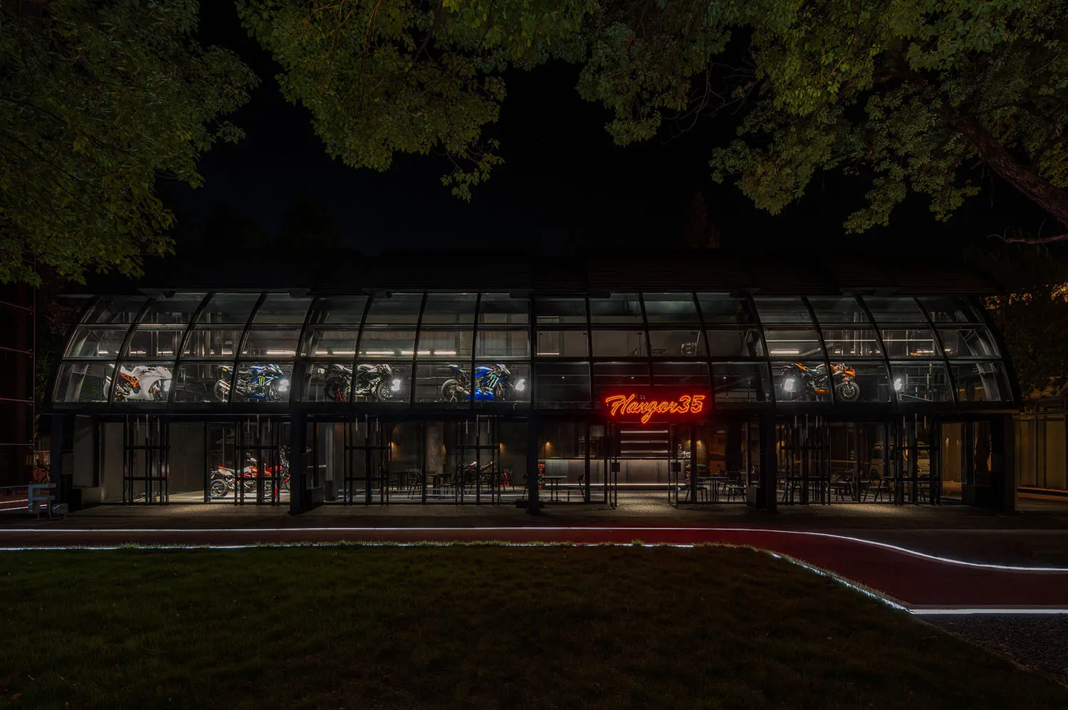 Modern retail store with glass walls at night