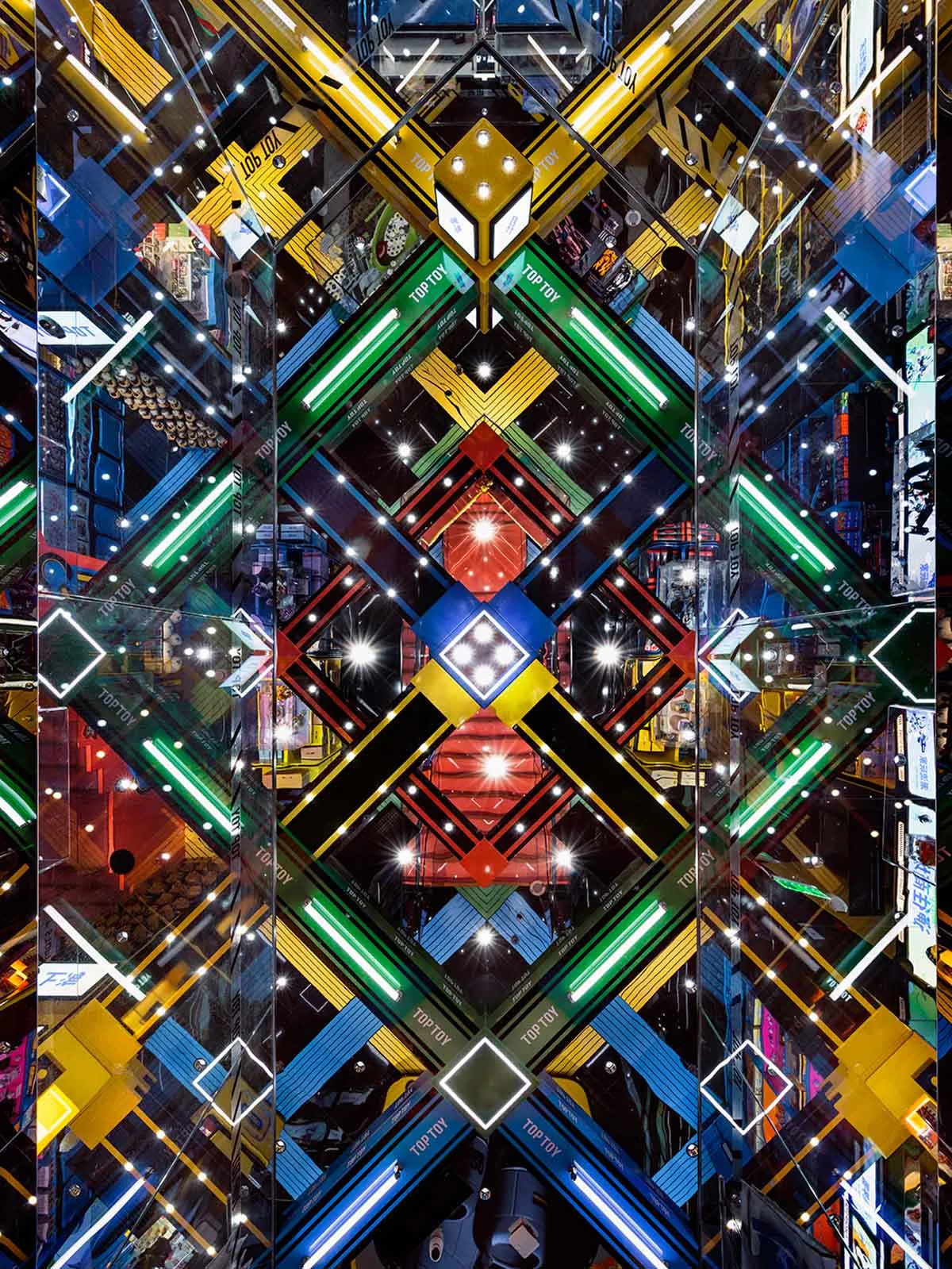 A vibrant, geometric digital illustration featuring multicolored shapes and patterns.